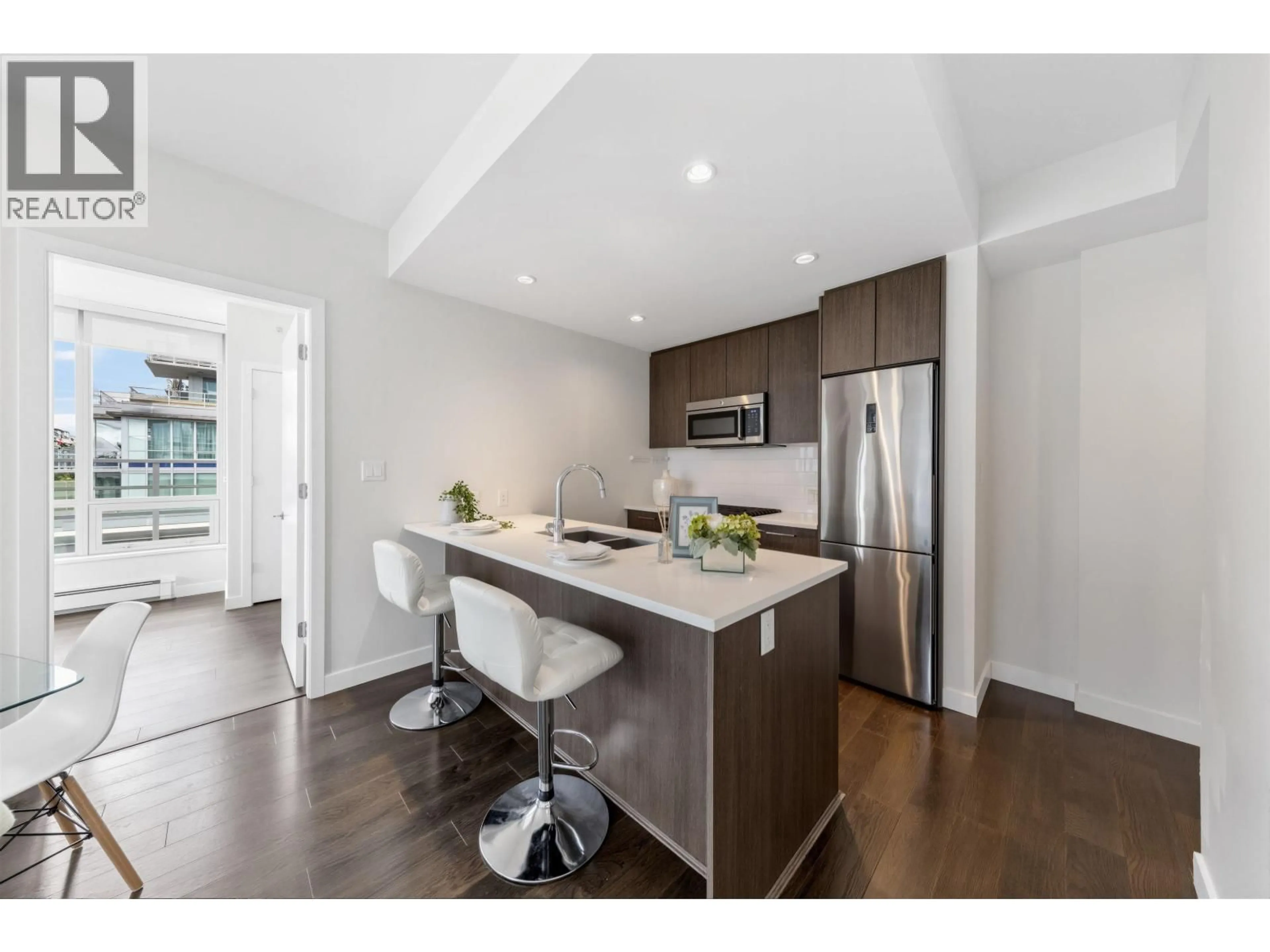 Open concept kitchen, wood/laminate floor for 708 - 9060 UNIVERSITY CRESCENT, Burnaby British Columbia V5A0E1
