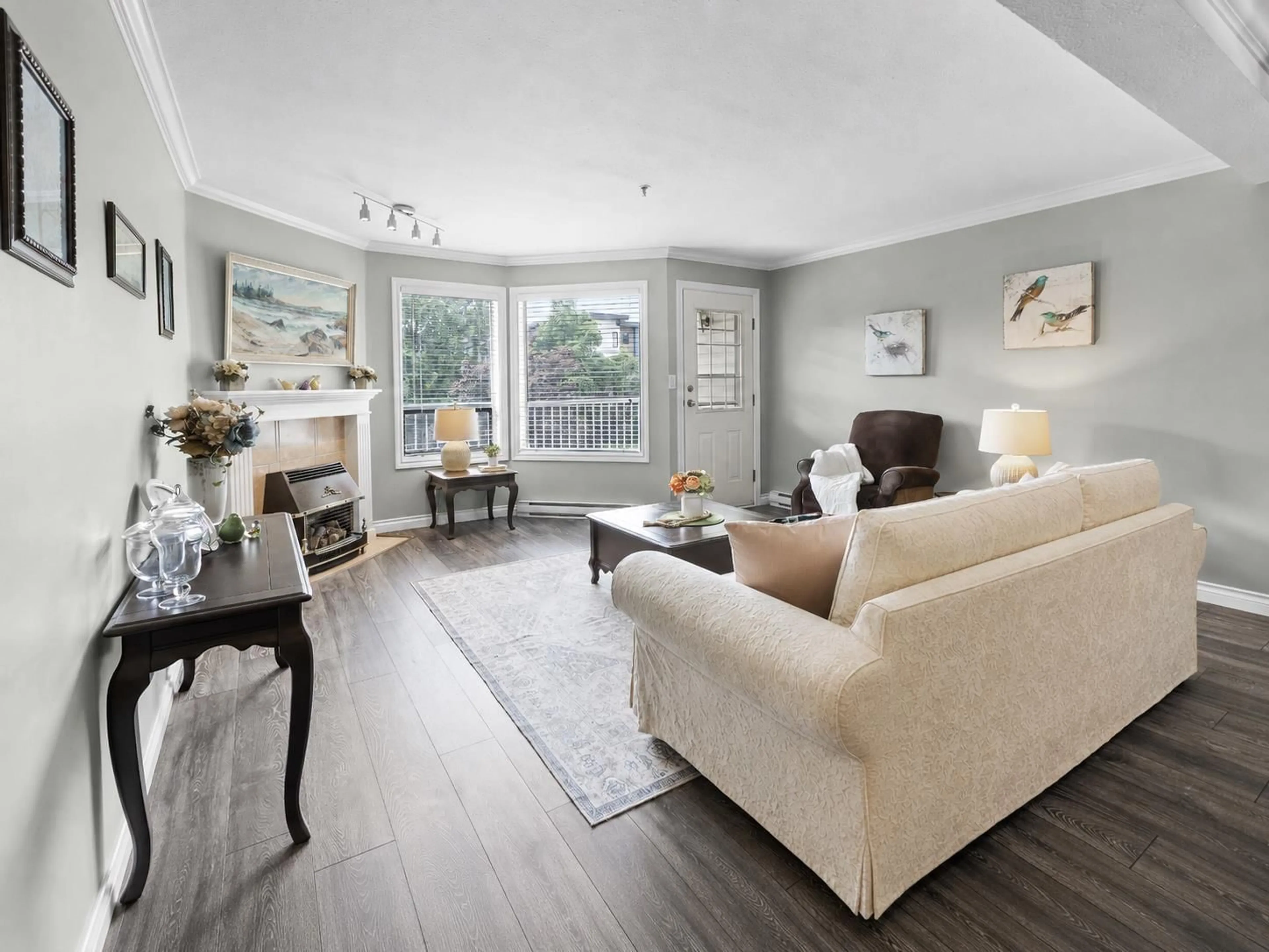 Living room with furniture, wood/laminate floor for 218 - 5710 201 STREET, Langley British Columbia V3A8A8