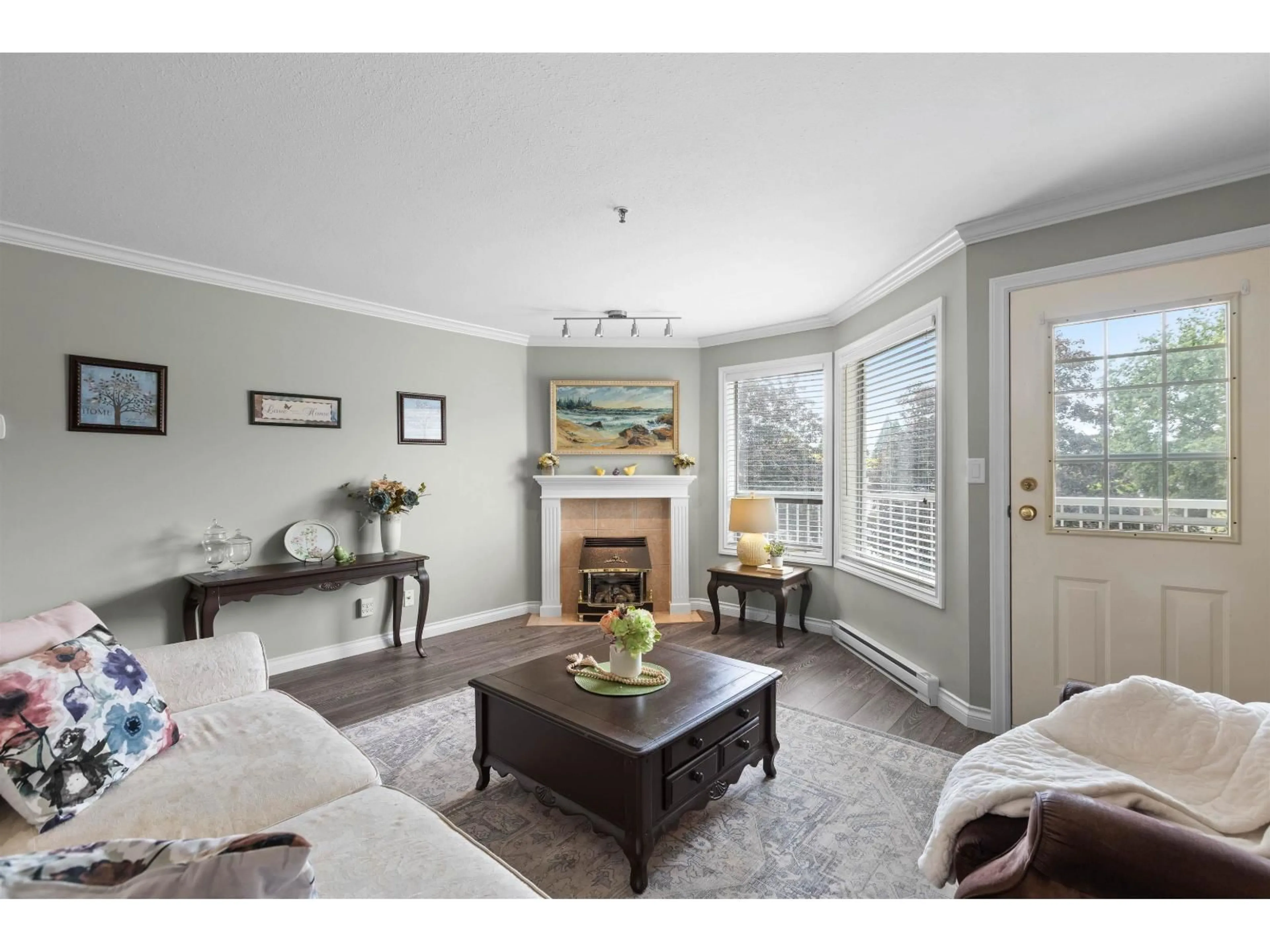 Living room with furniture, wood/laminate floor for 218 - 5710 201 STREET, Langley British Columbia V3A8A8