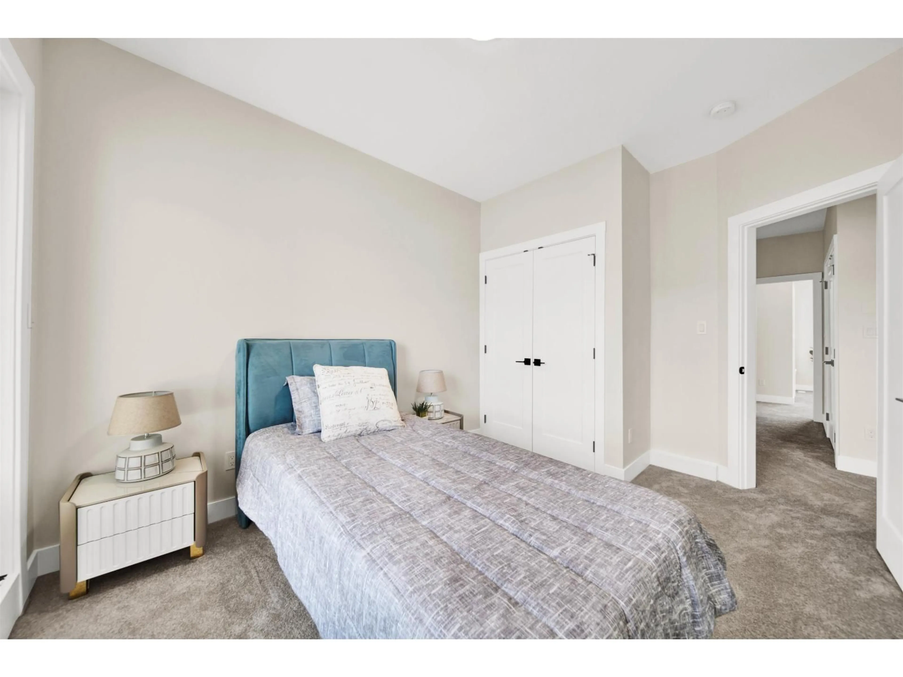 Bedroom with bed, carpet floor for 102 - 163 175A STREET, Surrey British Columbia V3Z1L1