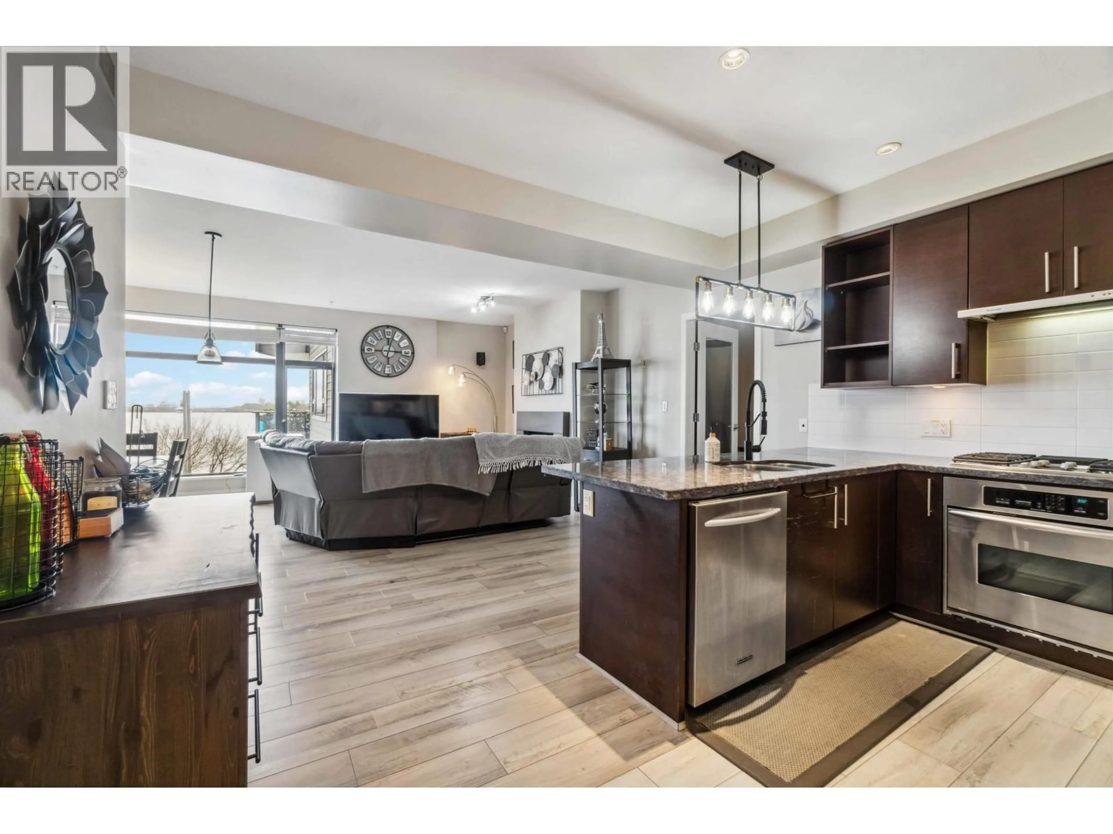 Open concept kitchen, ceramic/tile floor for 201 - 14300 RIVERPORT WAY, Richmond British Columbia V6W0A4
