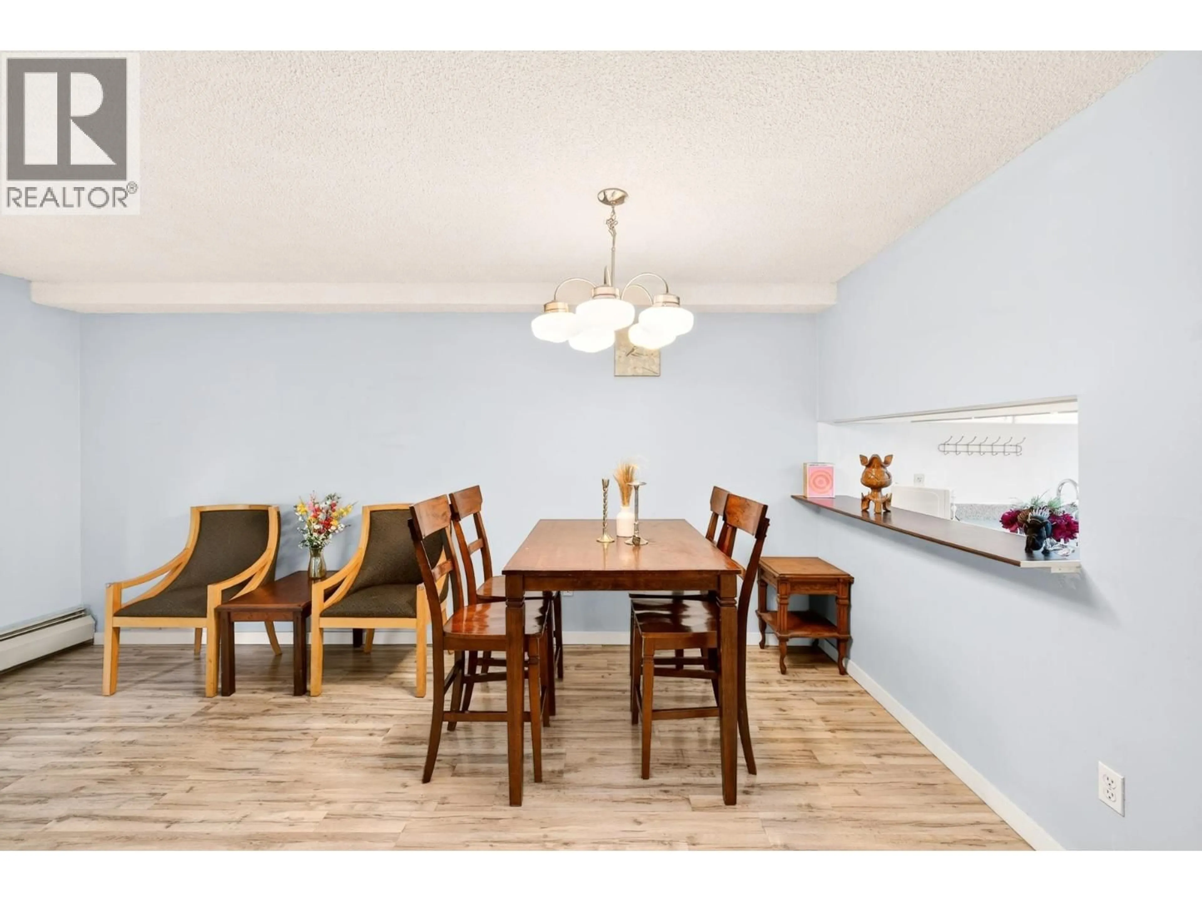 Dining room, wood/laminate floor for 102 - 8460 ACKROYD ROAD, Richmond British Columbia V6X3E9