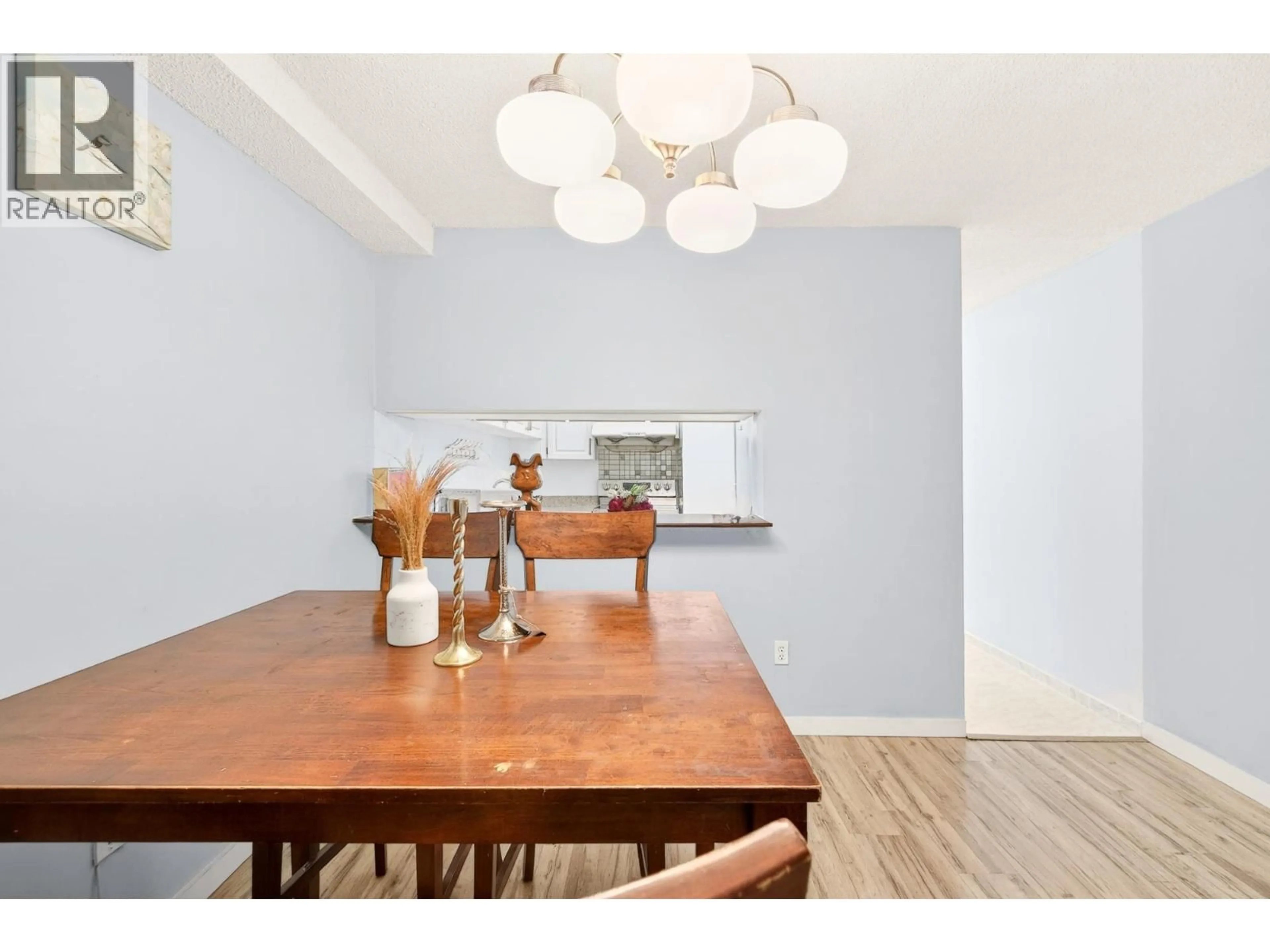 Dining room, wood/laminate floor for 102 - 8460 ACKROYD ROAD, Richmond British Columbia V6X3E9