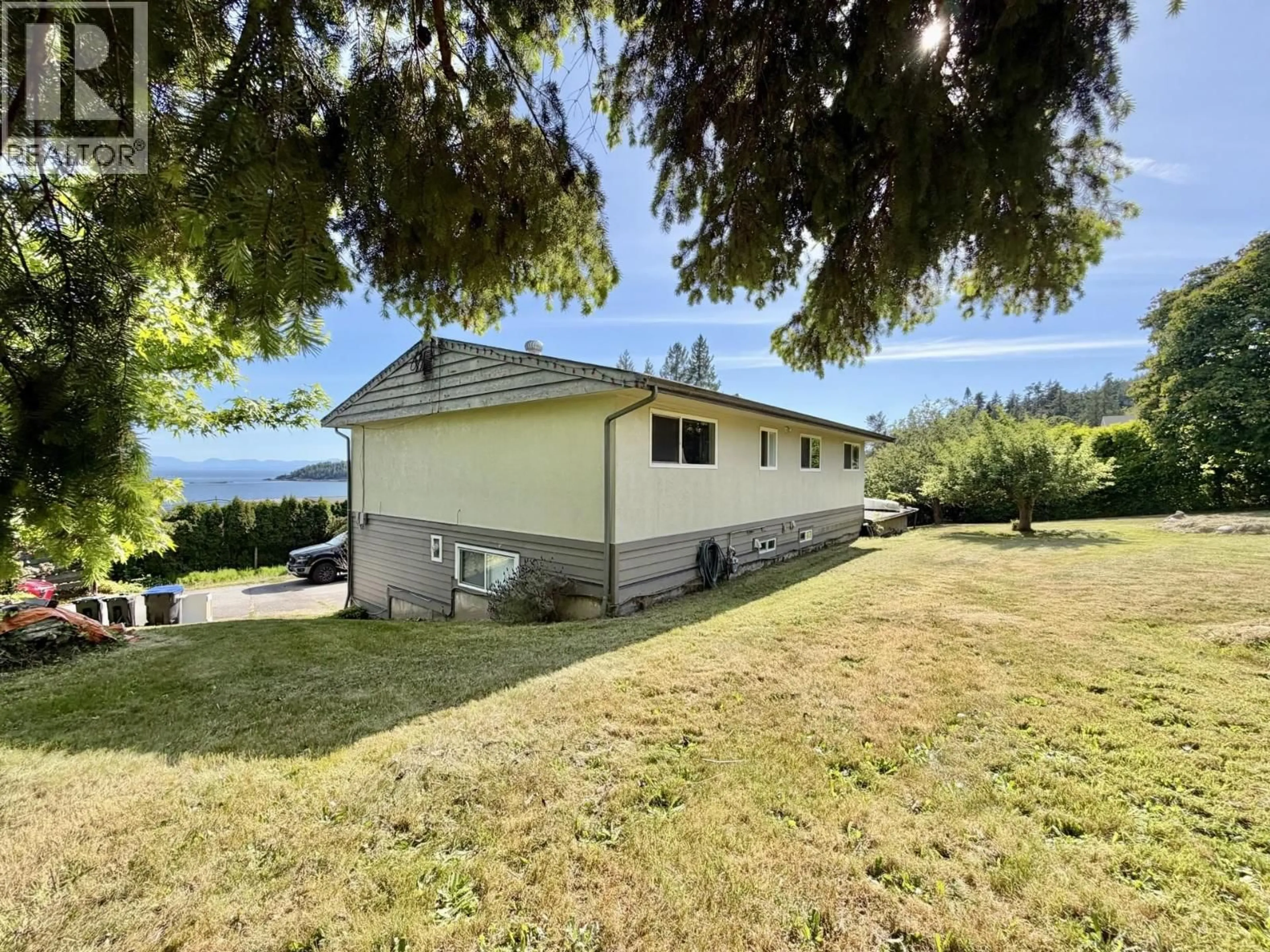 A pic from outside/outdoor area/front of a property/back of a property/a pic from drone, water/lake/river/ocean view for 5439 MASON ROAD, Sechelt British Columbia V0N3A8