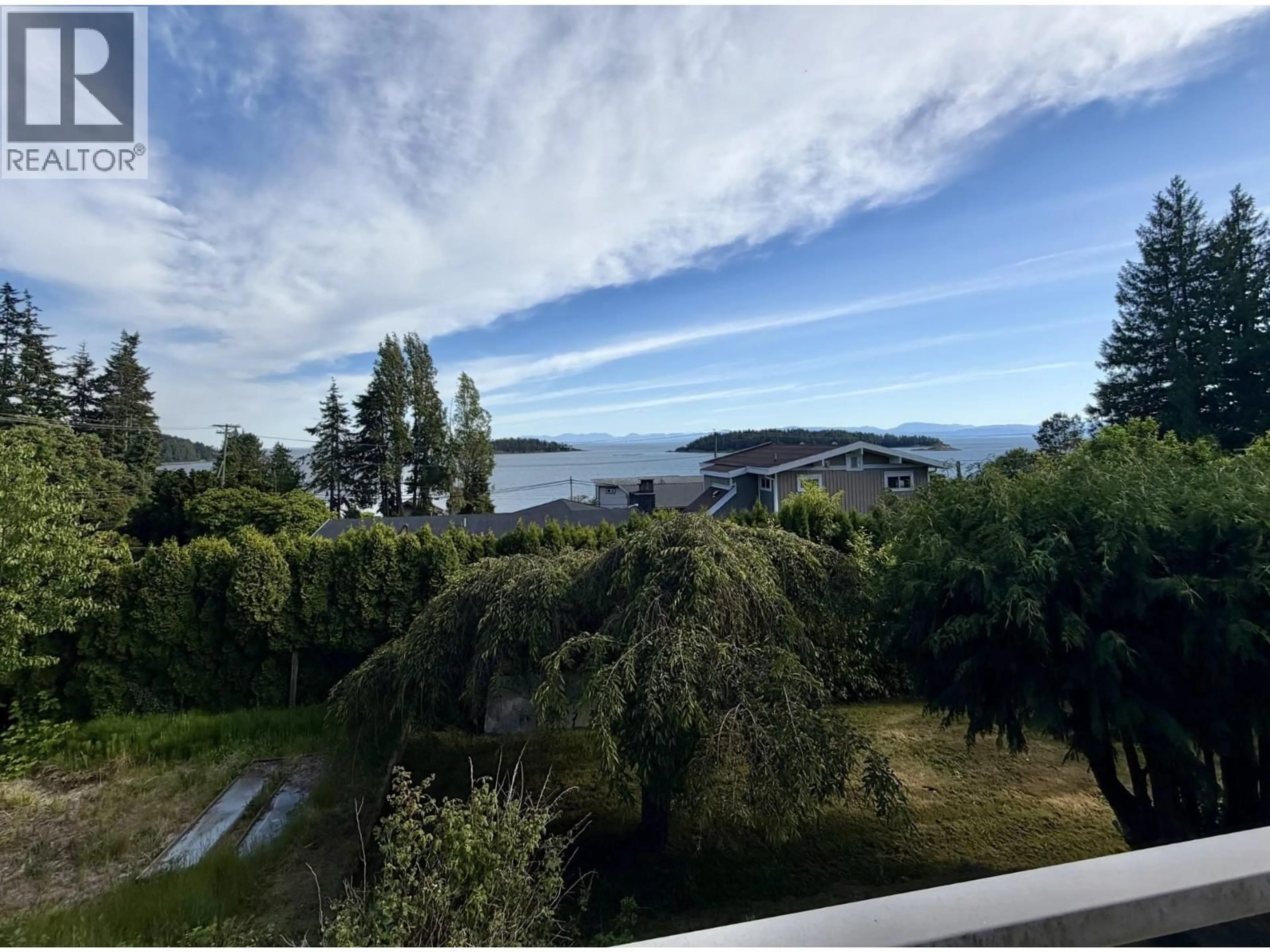A pic from outside/outdoor area/front of a property/back of a property/a pic from drone, water/lake/river/ocean view for 5439 MASON ROAD, Sechelt British Columbia V0N3A8