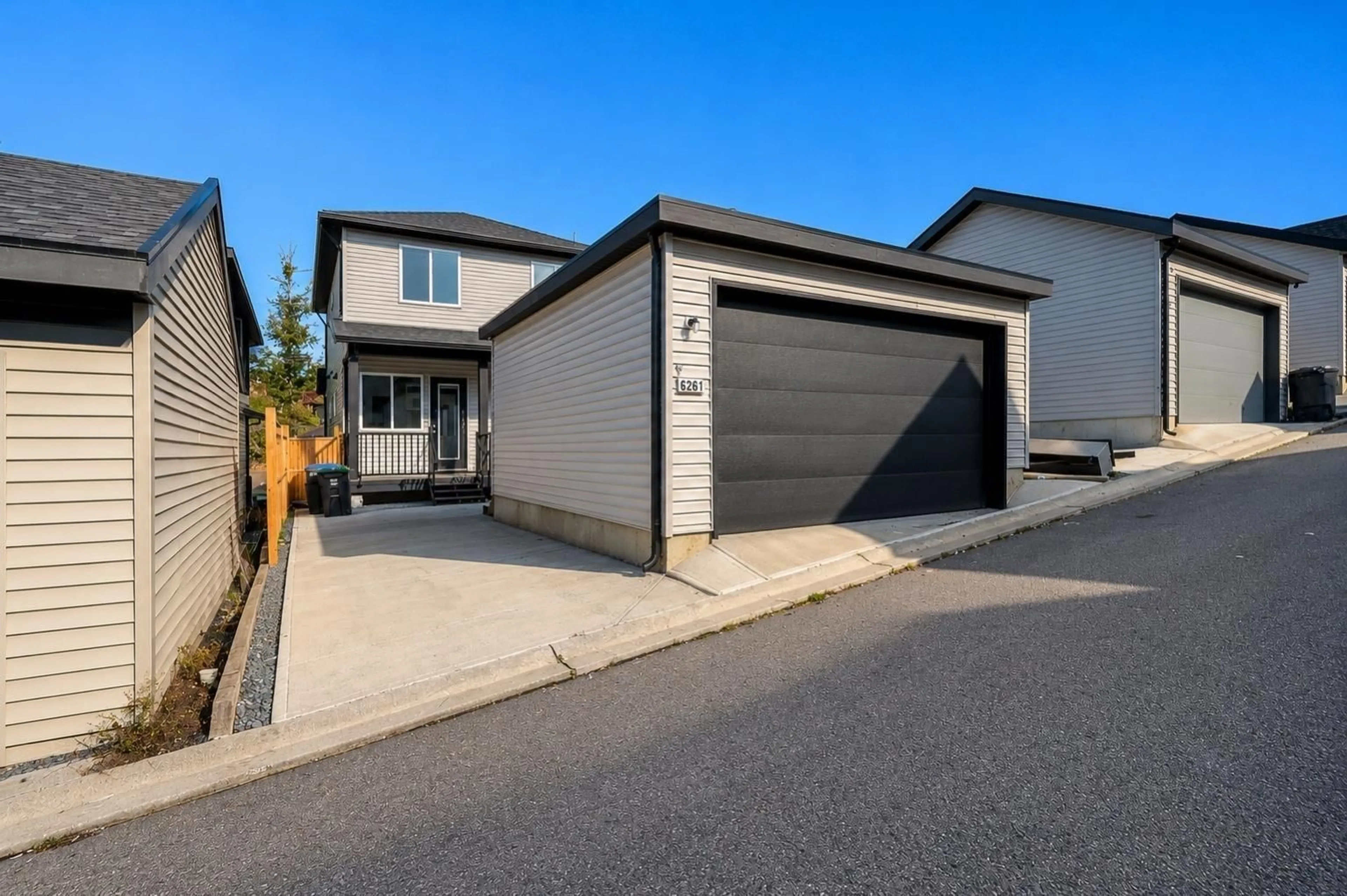 A pic from outside/outdoor area/front of a property/back of a property/a pic from drone, street for 6261 148 STREET, Surrey British Columbia V3S3T1