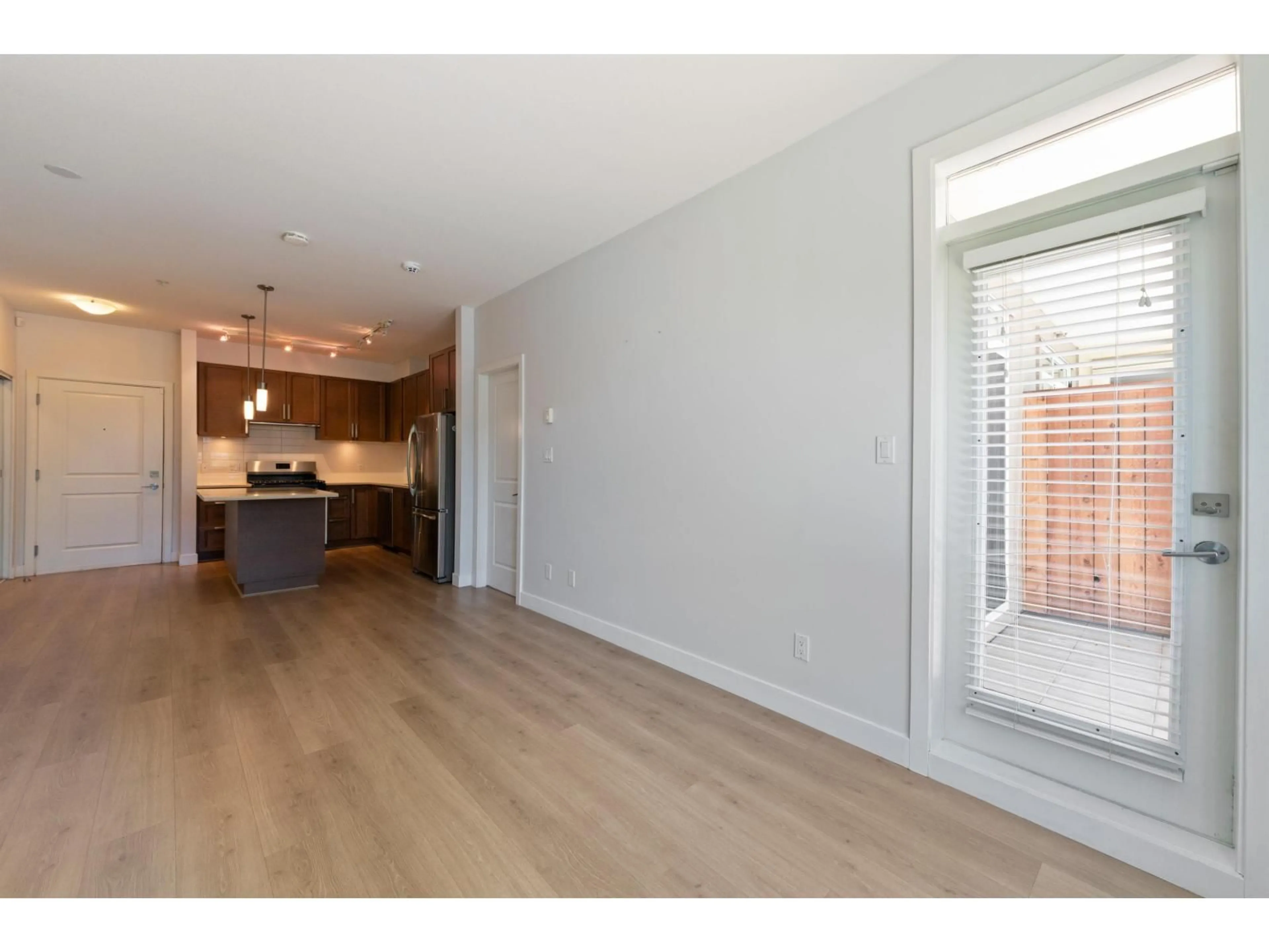 Open concept kitchen, wood/laminate floor for 226 - 15850 26 AVENUE, Surrey British Columbia V3Z2N6