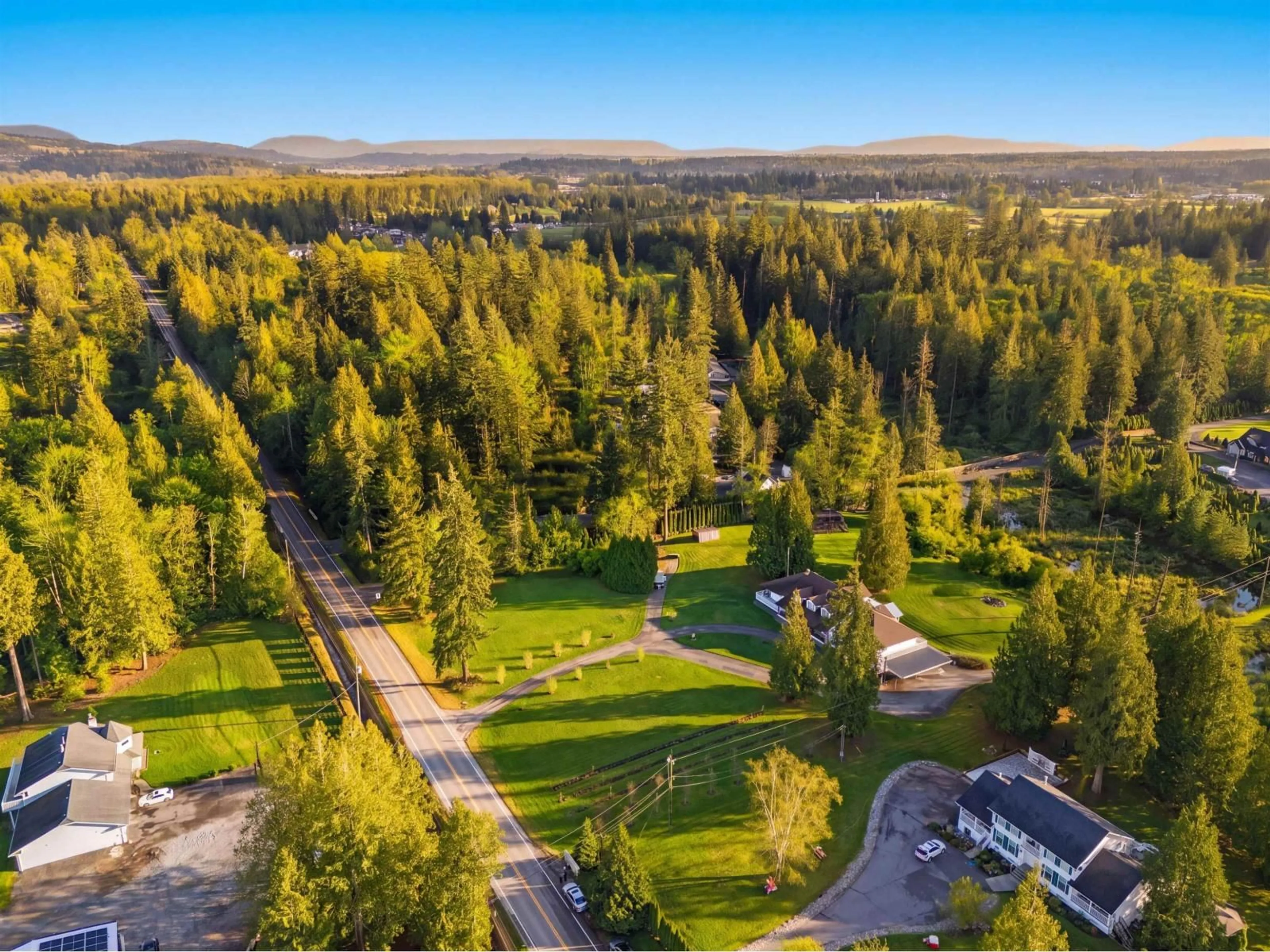 A pic from outside/outdoor area/front of a property/back of a property/a pic from drone, forest/trees view for 21980 100 AVENUE, Langley British Columbia V1M3V1
