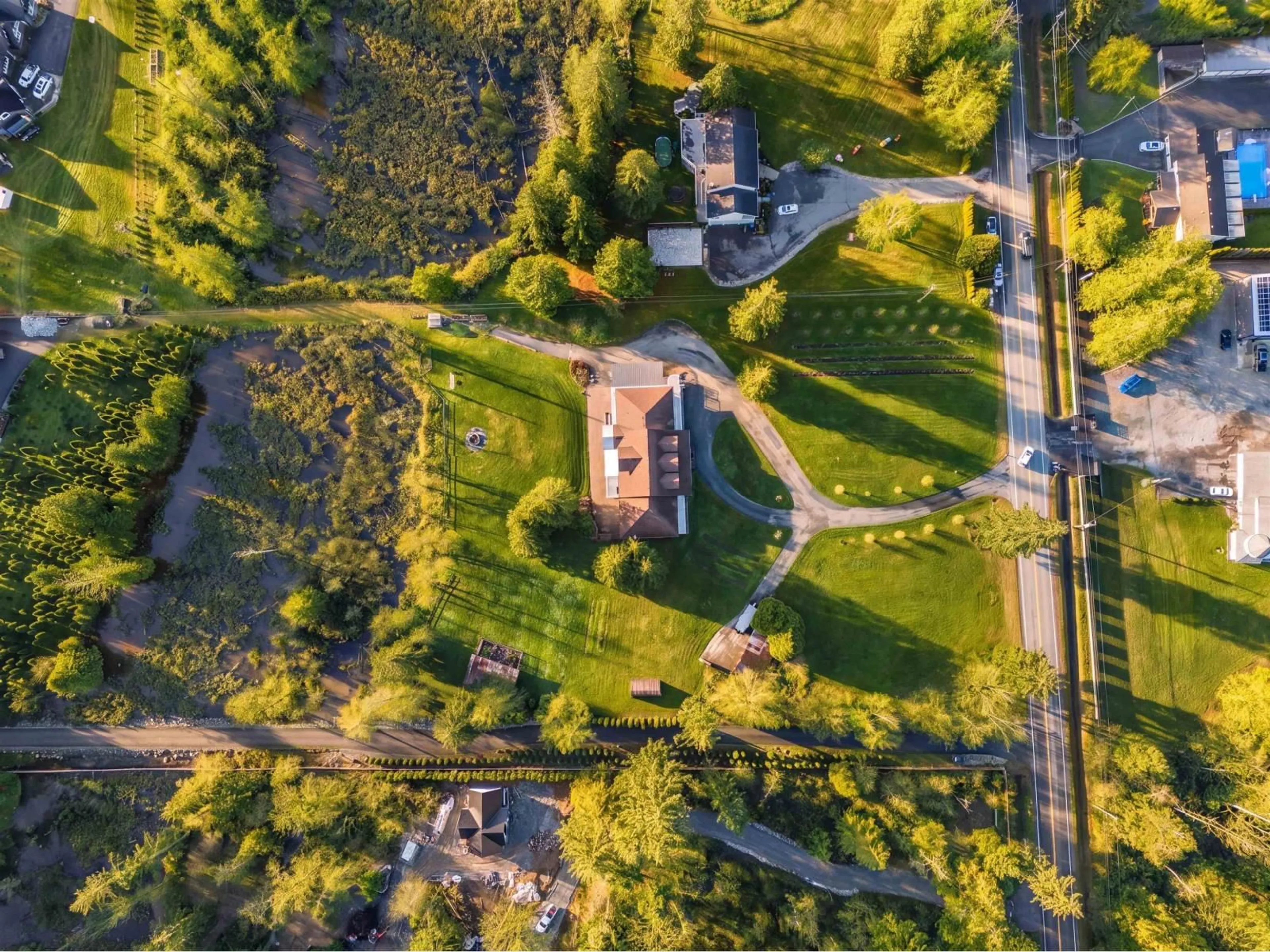 A pic from outside/outdoor area/front of a property/back of a property/a pic from drone, street for 21980 100 AVENUE, Langley British Columbia V1M3V1