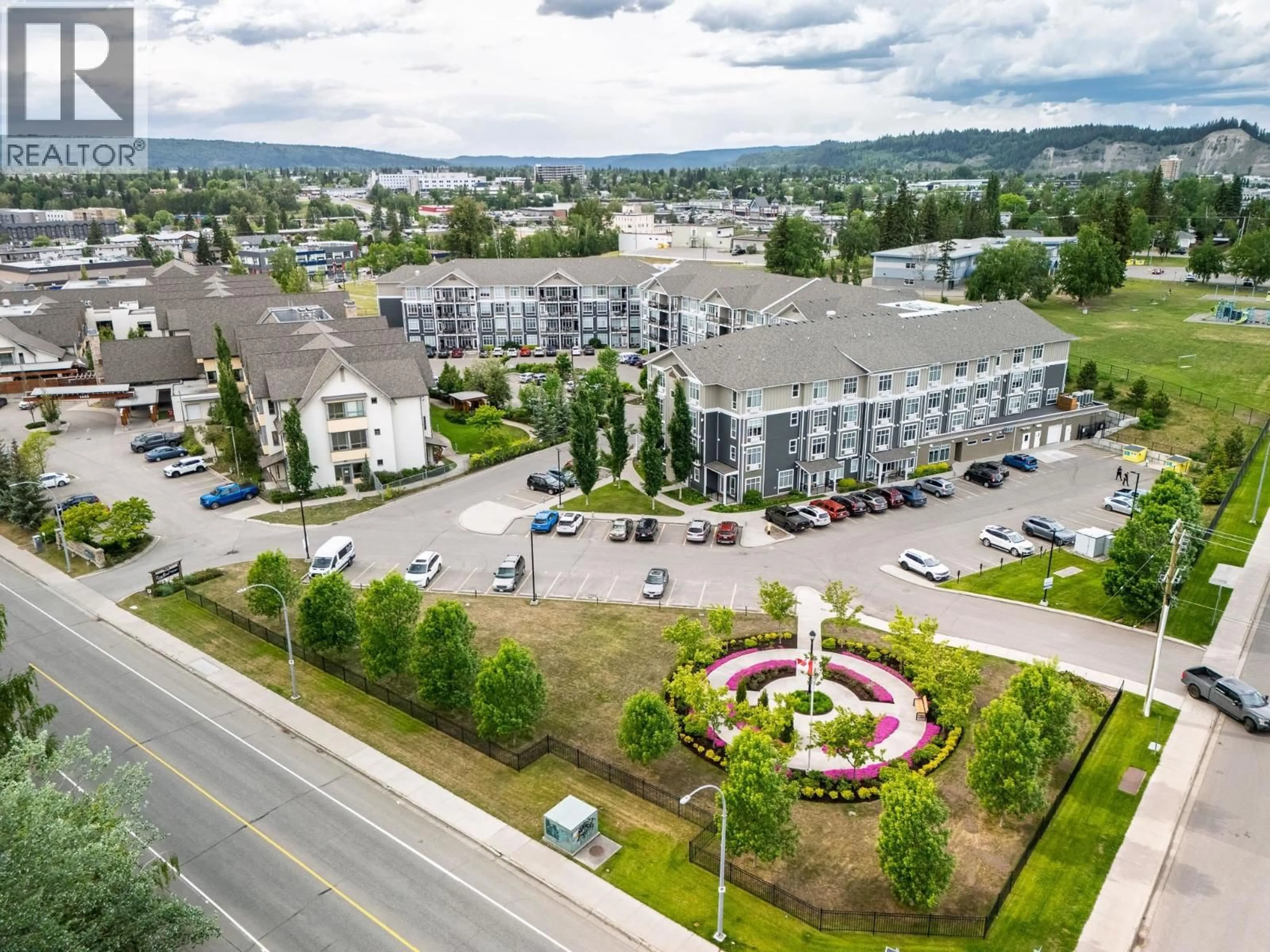 A pic from outside/outdoor area/front of a property/back of a property/a pic from drone, mountain view for 105 - 1444 20TH AVENUE, Prince George British Columbia V2L0C9