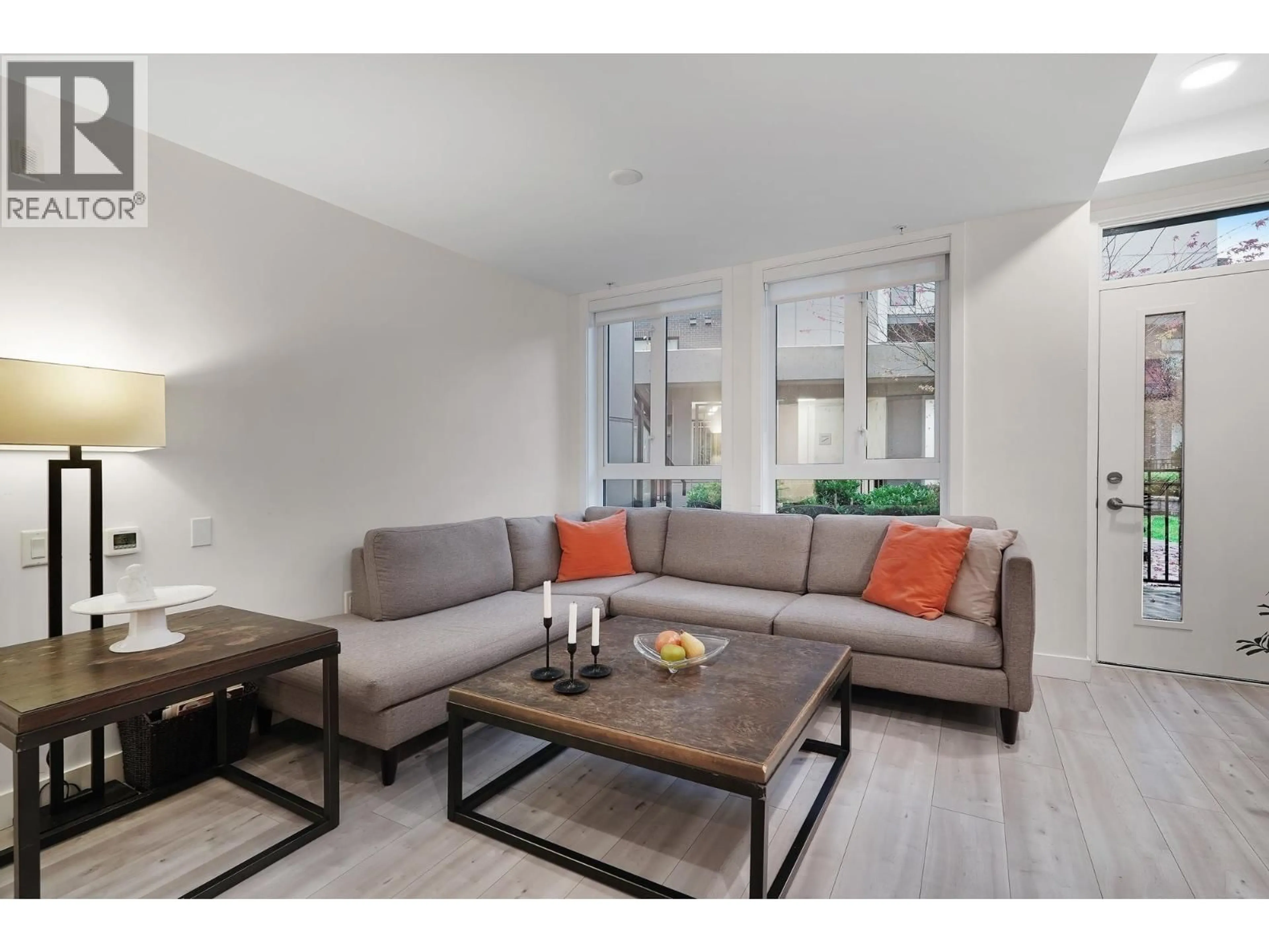 Living room with furniture, wood/laminate floor for 124 - 2035 GLENAIRE DRIVE, North Vancouver British Columbia V7P1Y2