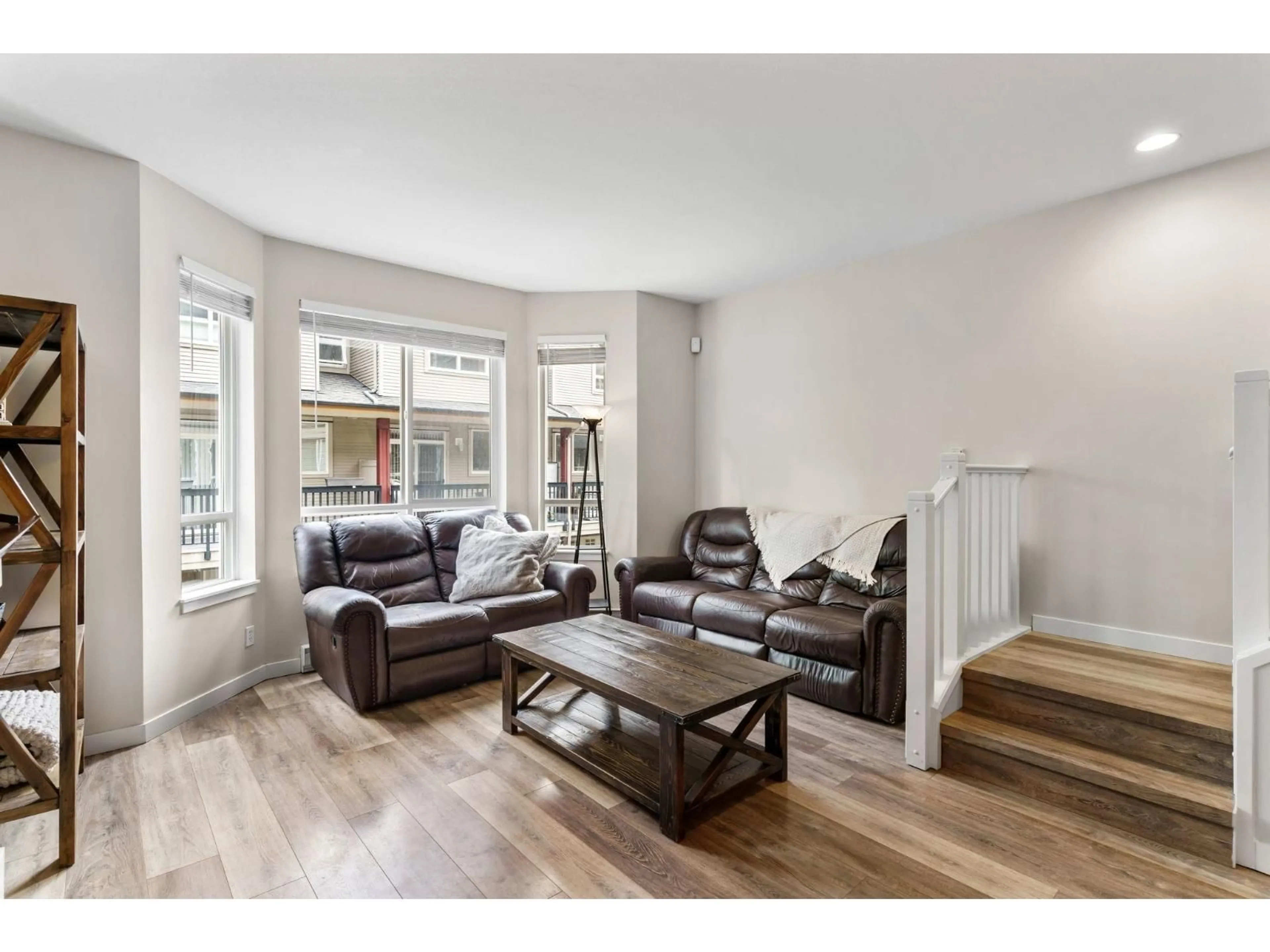 Living room with furniture, wood/laminate floor for 6 - 16772 61 AVENUE, Surrey British Columbia V3S4P2