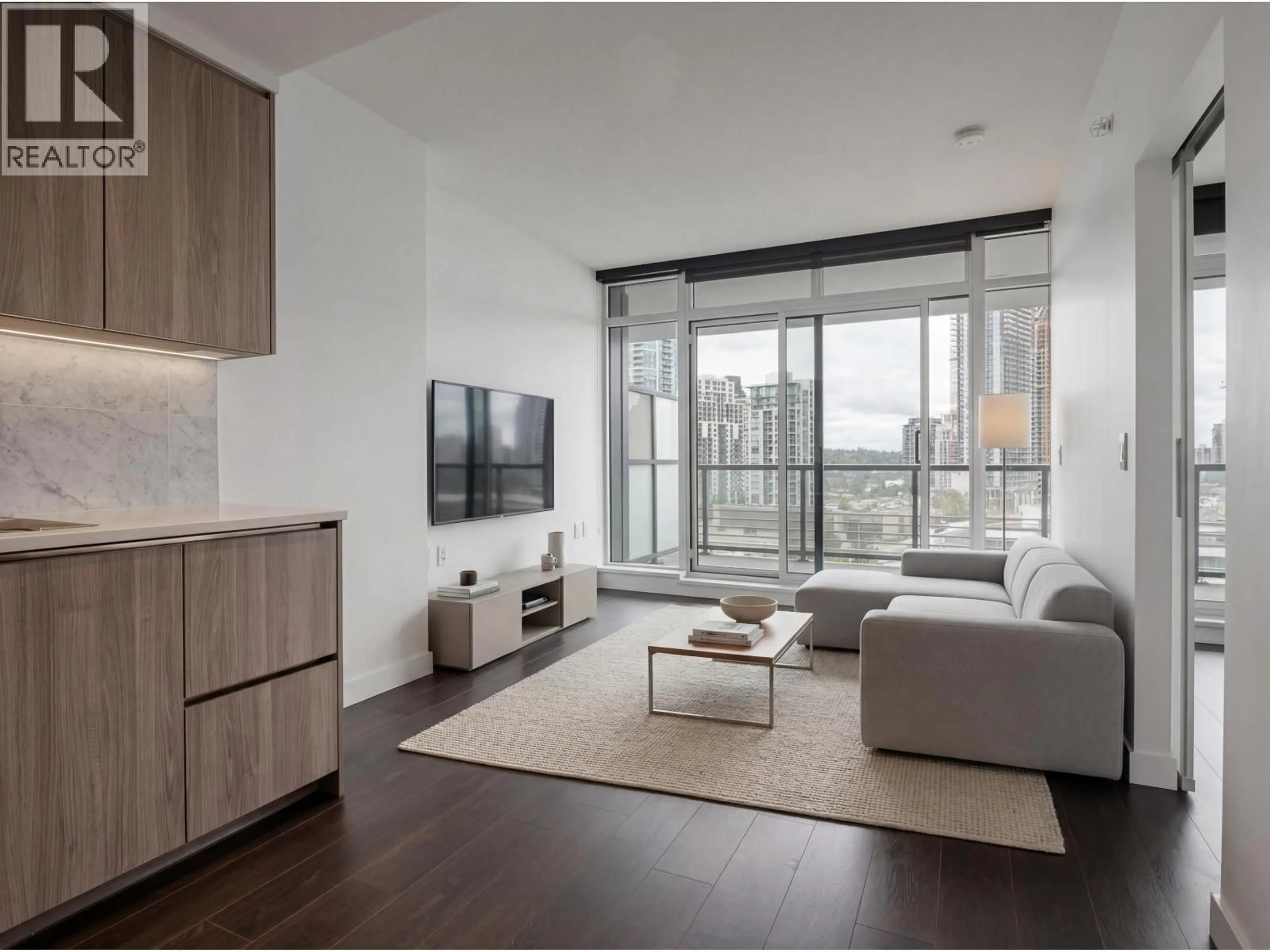 Living room with furniture, wood/laminate floor for 601 - 4720 LOUGHEED HIGHWAY, Burnaby British Columbia V5C0M8