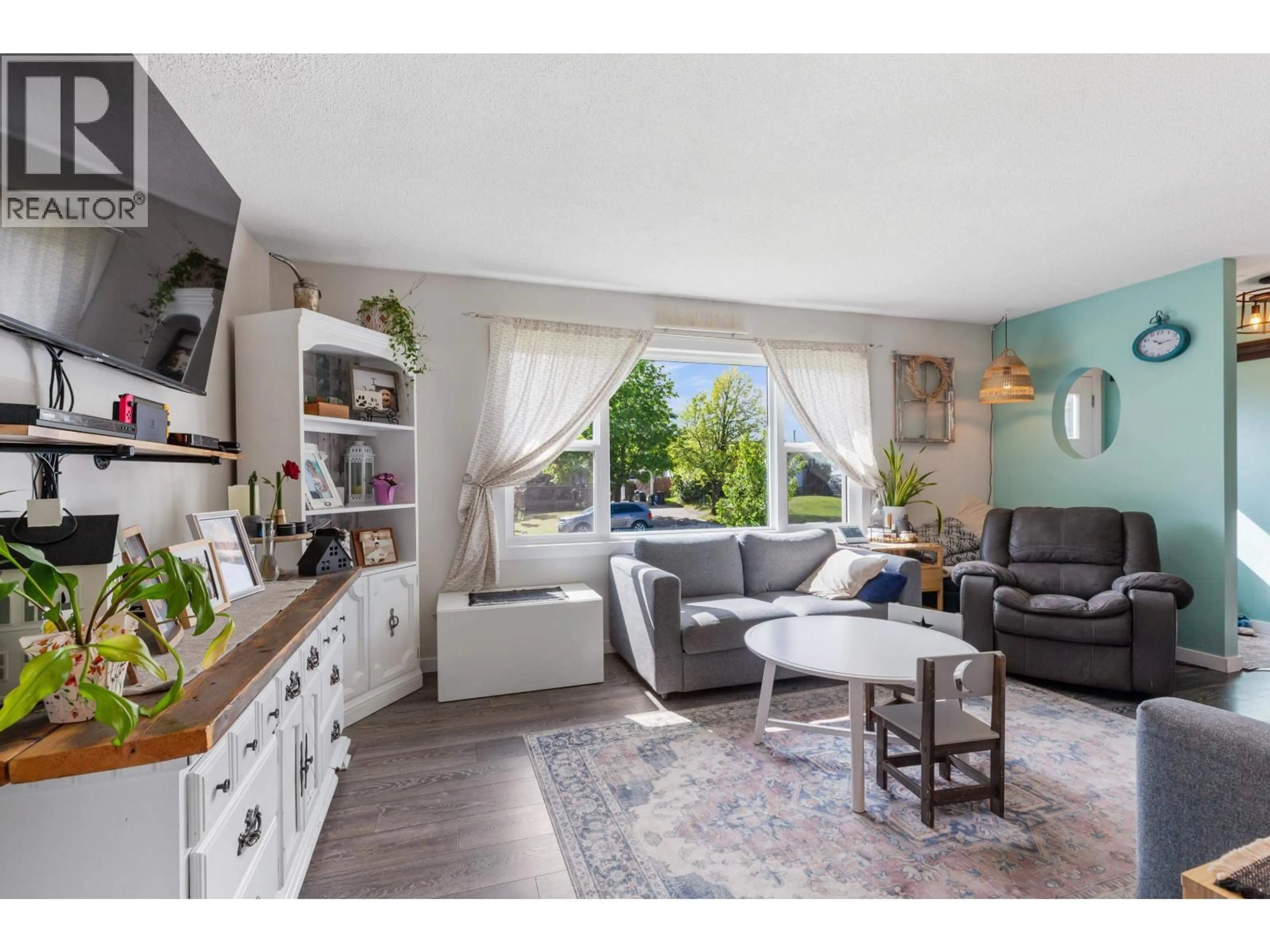 Living room with furniture, wood/laminate floor for 3908 ENEMARK CRESCENT, Prince George British Columbia V2N2X5