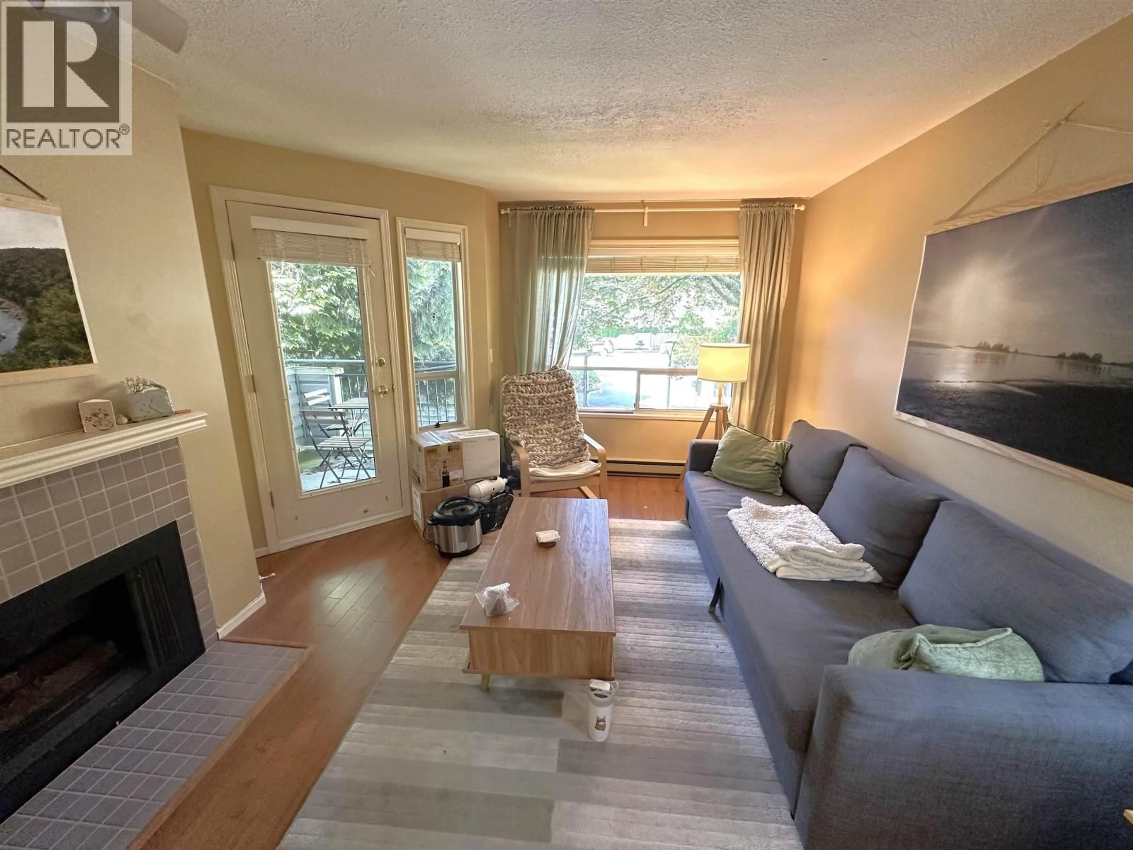 Living room with furniture, wood/laminate floor for 116 - 7760 MOFFATT ROAD, Richmond British Columbia V6Y1X8