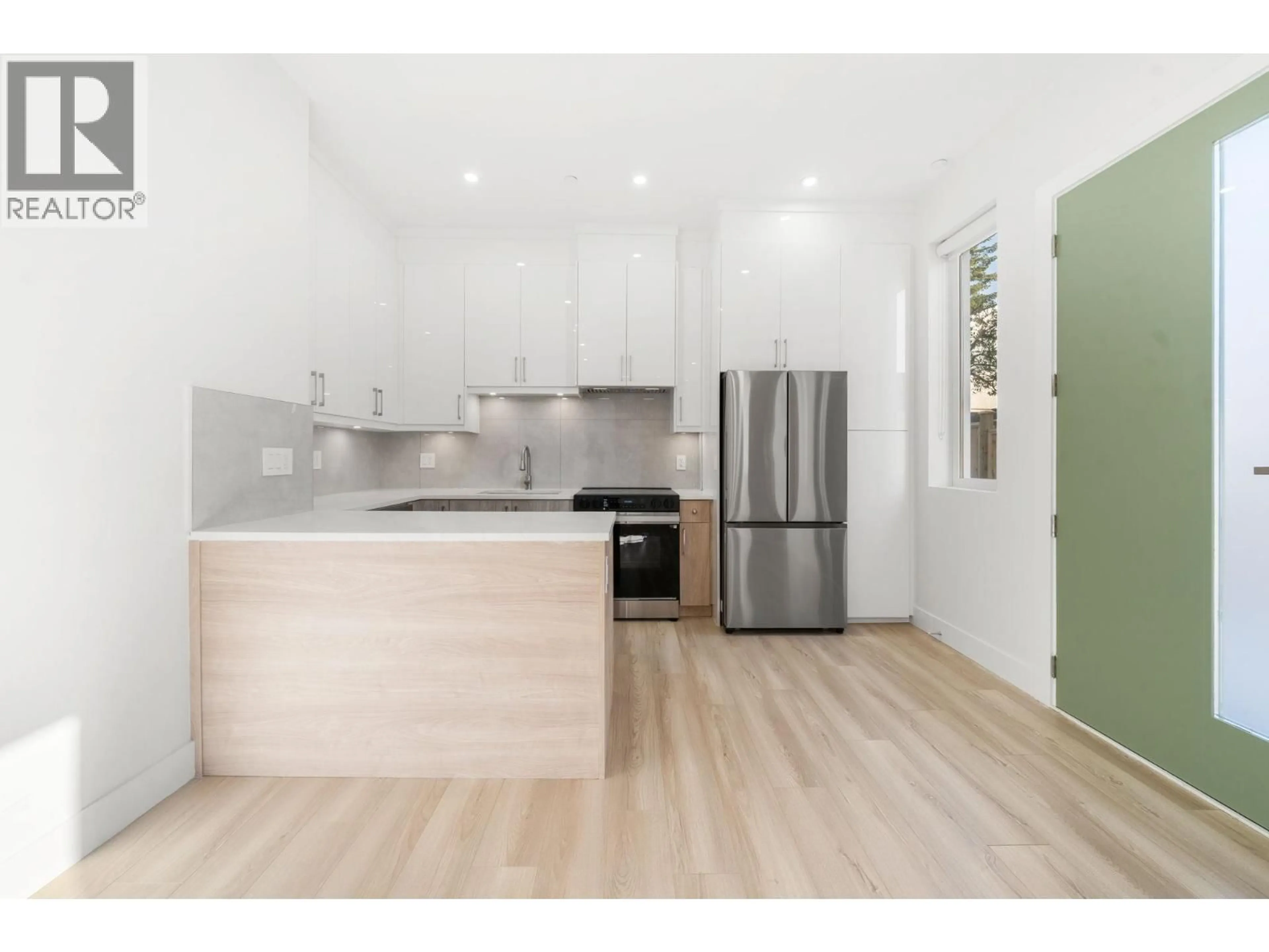 Open concept kitchen, wood/laminate floor for 1 - 3583 HAIDA STREET, Vancouver British Columbia V5M3Y9