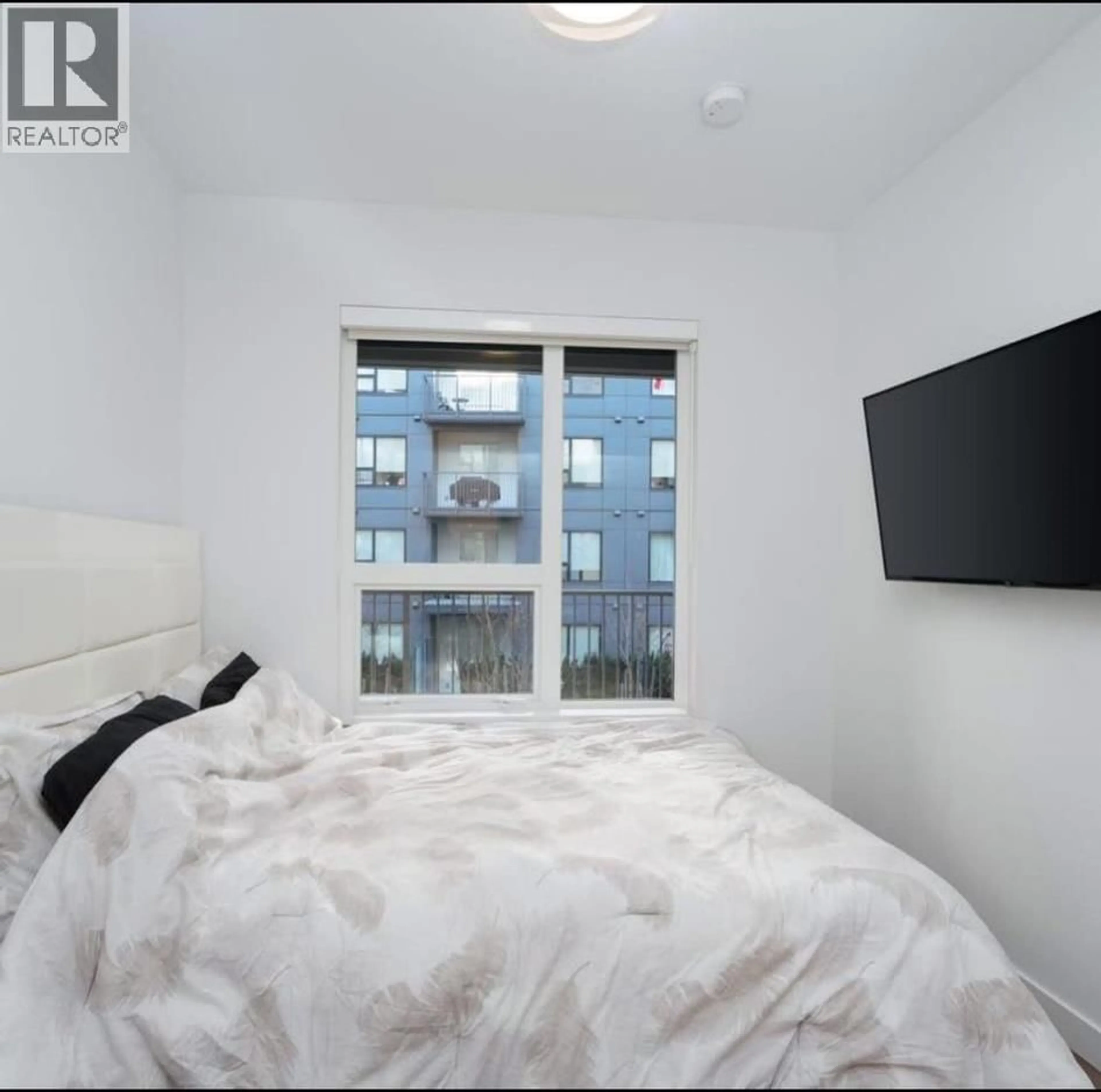 Bedroom with bed, unknown for 217 - 645 COMO LAKE AVENUE, Coquitlam British Columbia V3J0N9