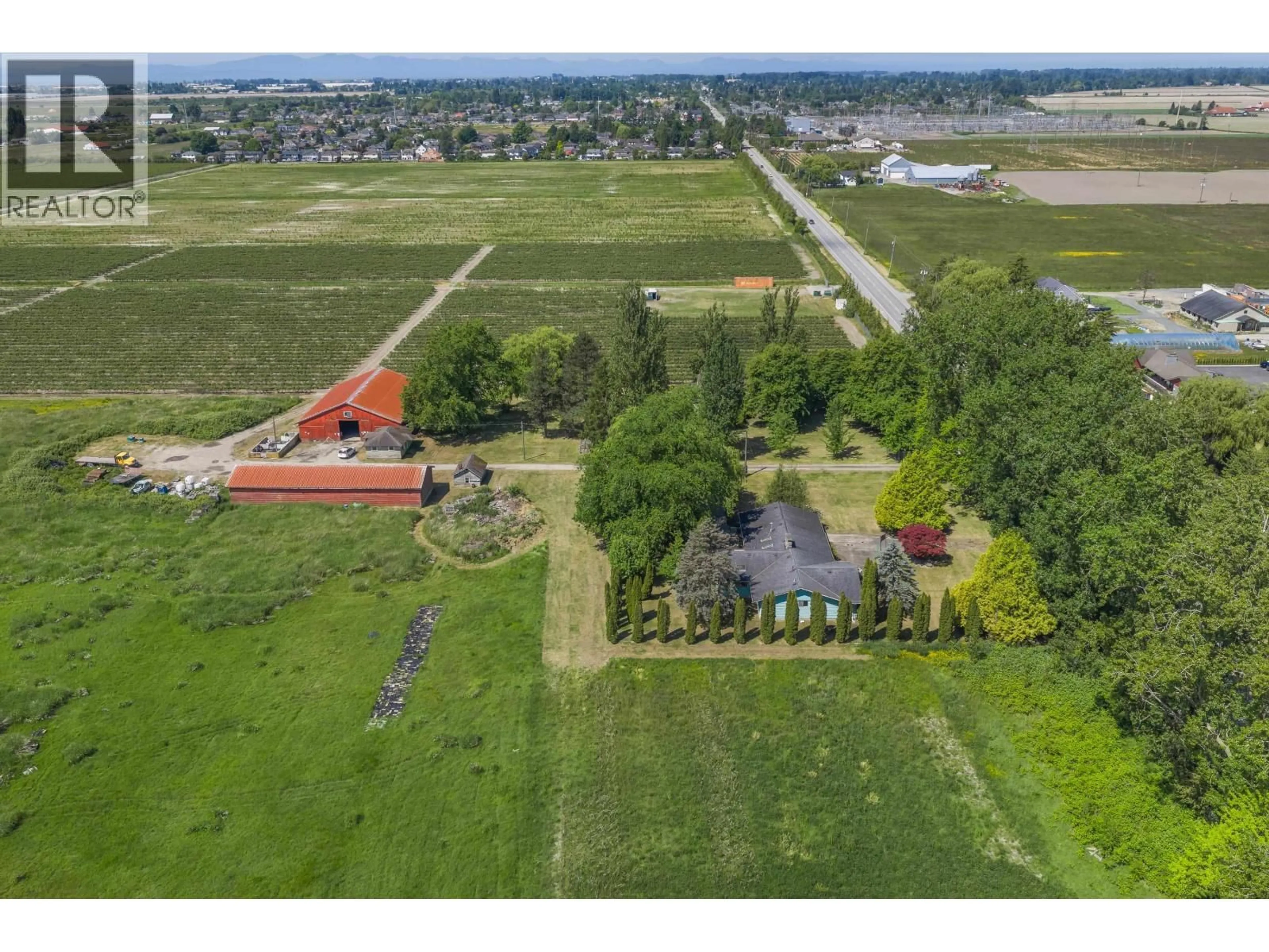 A pic from outside/outdoor area/front of a property/back of a property/a pic from drone, unknown for 7064 LADNER TRUNK ROAD, Delta British Columbia V4K3N3