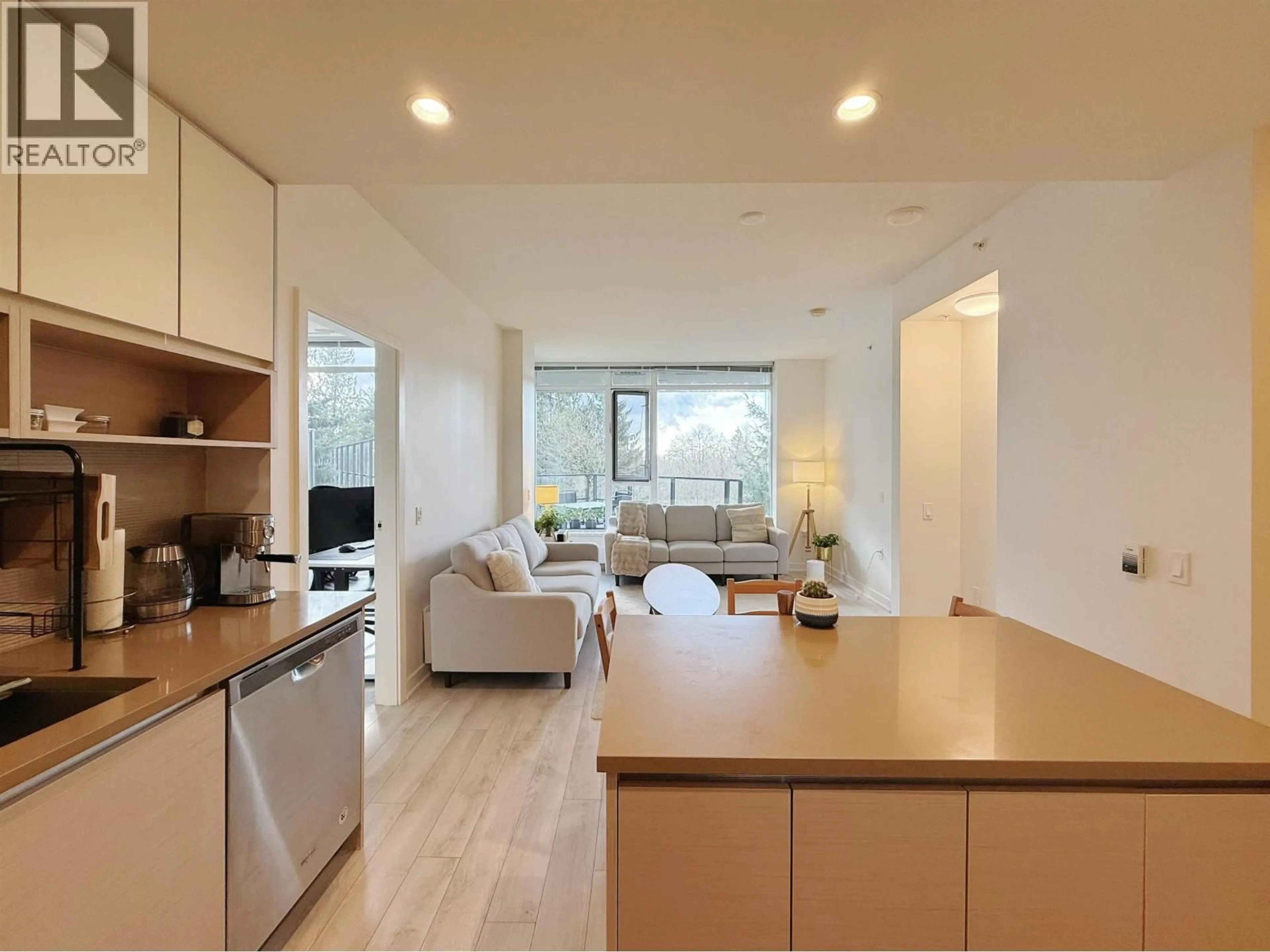 Open concept kitchen, wood/laminate floor for 105 - 8850 UNIVERSITY CRESCENT, Burnaby British Columbia V5A0C8