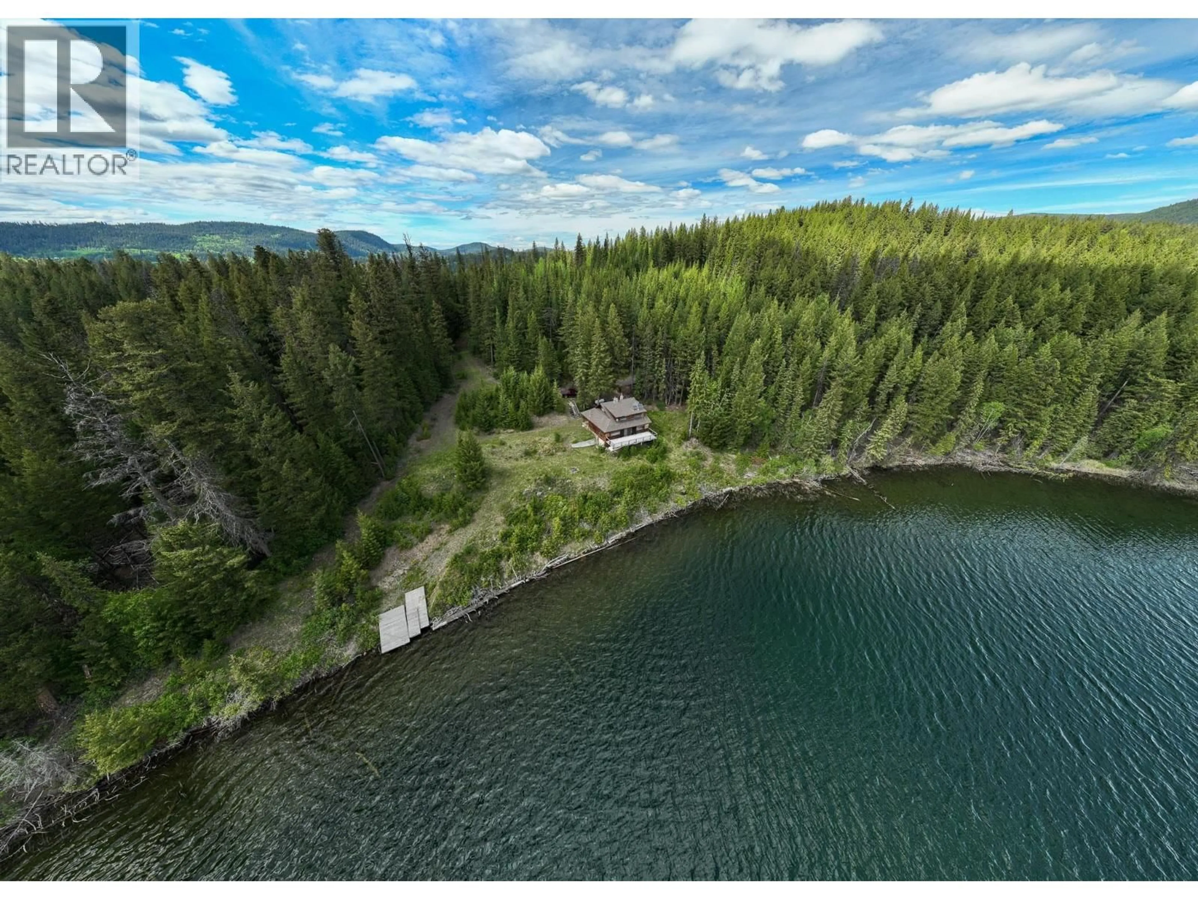 A pic from outside/outdoor area/front of a property/back of a property/a pic from drone, water/lake/river/ocean view for 7750 BURGESS ROAD, Deka Lake / Sulphurous / Hathaway Lakes British Columbia V0K1X3