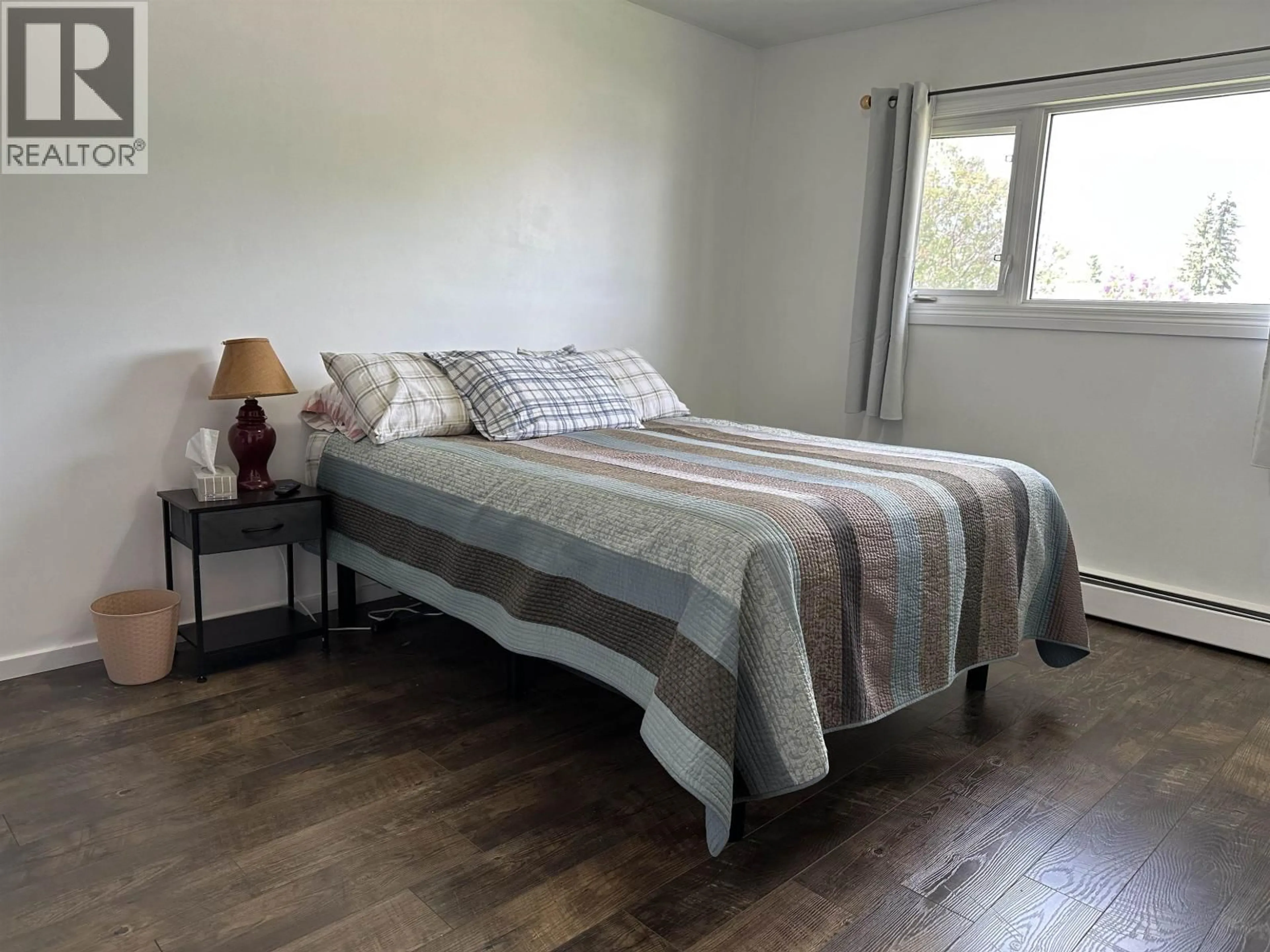 Bedroom with bed, wood/laminate floor for 9607 108 AVENUE, Fort St. John British Columbia V1J2P9