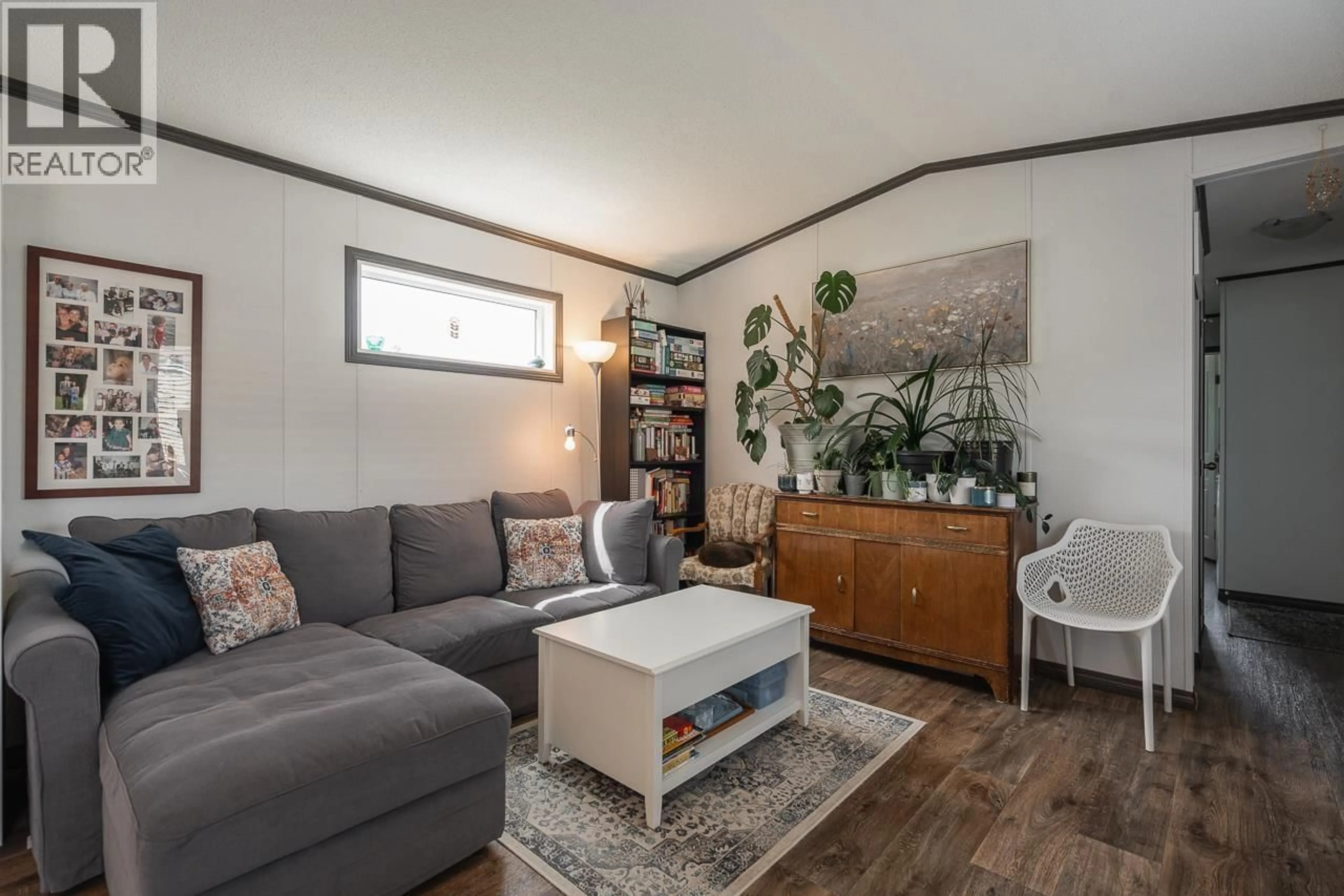 Living room with furniture, wood/laminate floor for 27 - 4072 LAC LA HACHE STATION ROAD, Lac La Hache British Columbia V0K1T1