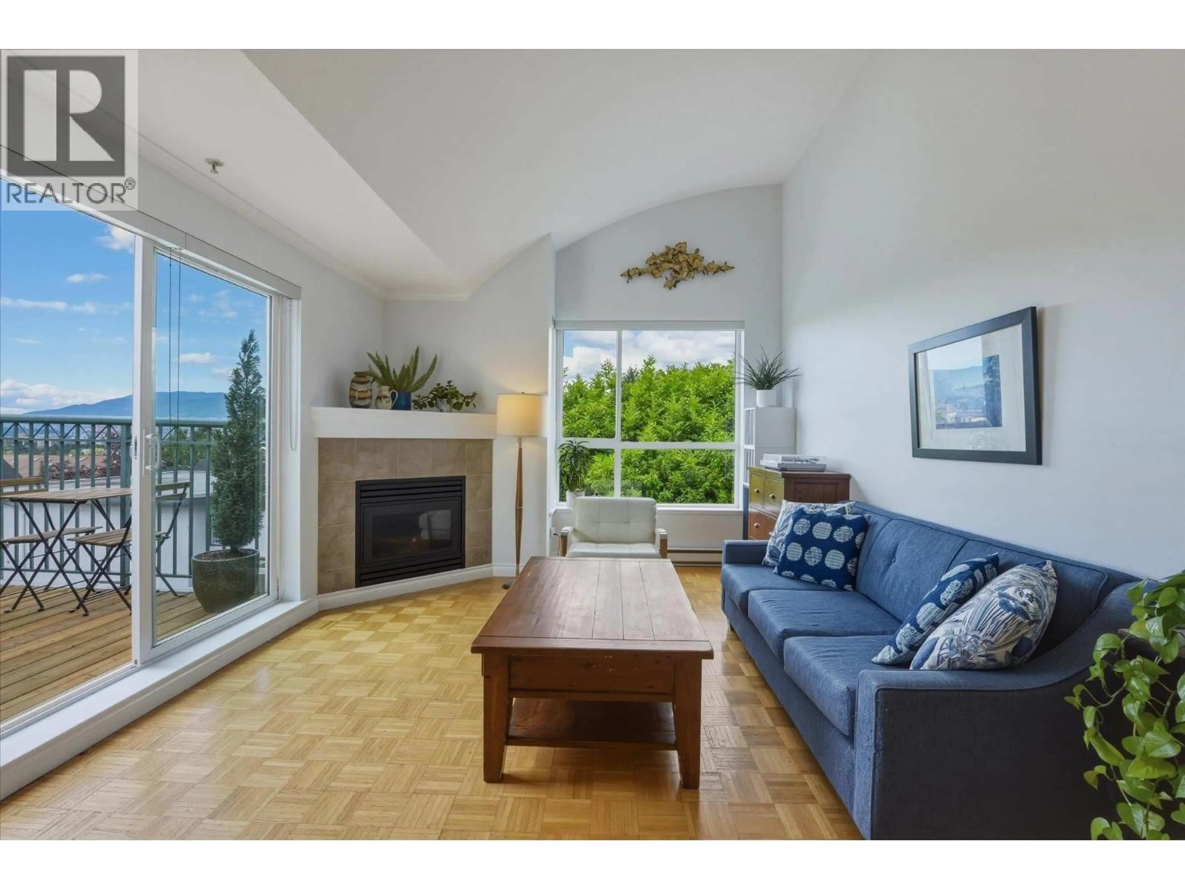 Living room with furniture, wood/laminate floor for 402 - 1617 GRANT STREET, Vancouver British Columbia V5L2Y4