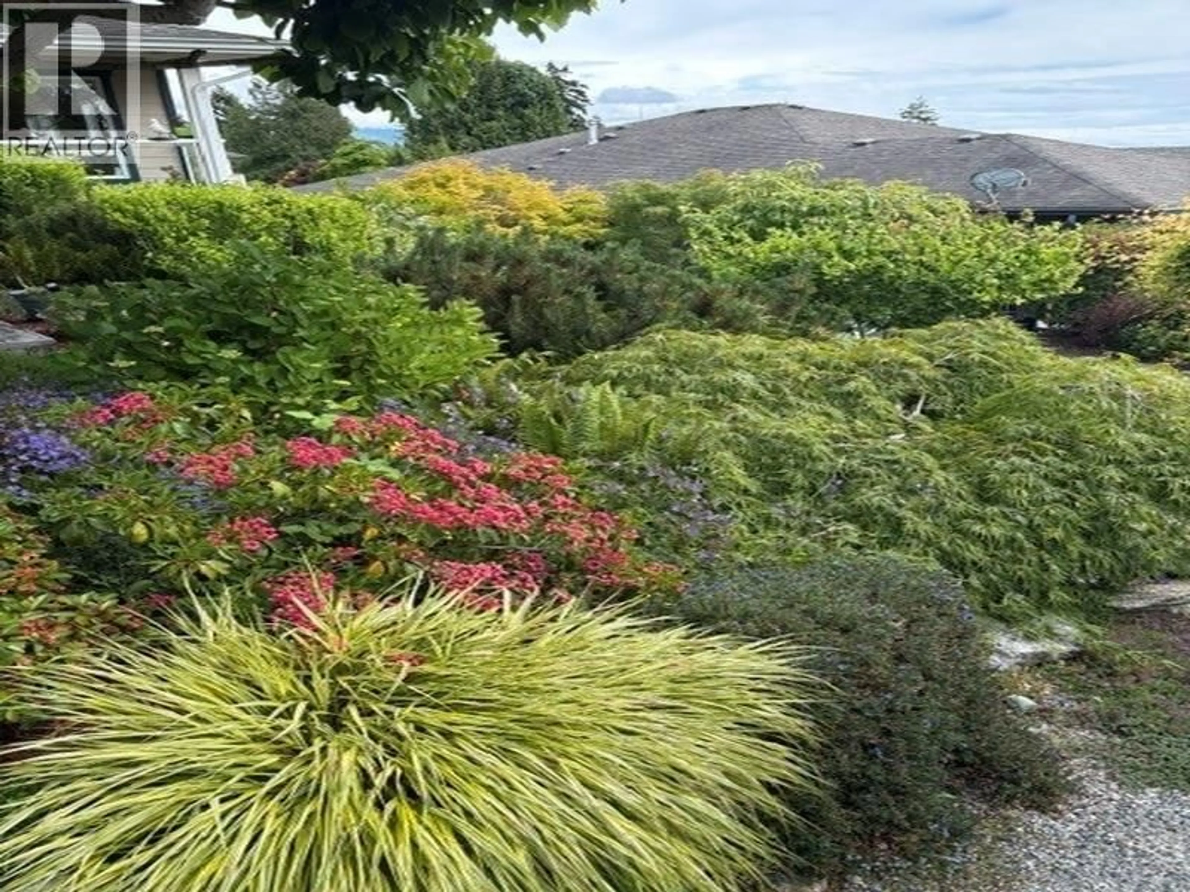 A pic from outside/outdoor area/front of a property/back of a property/a pic from drone, mountain view for 6252 BAILLIE ROAD, Sechelt British Columbia V7Z0R5