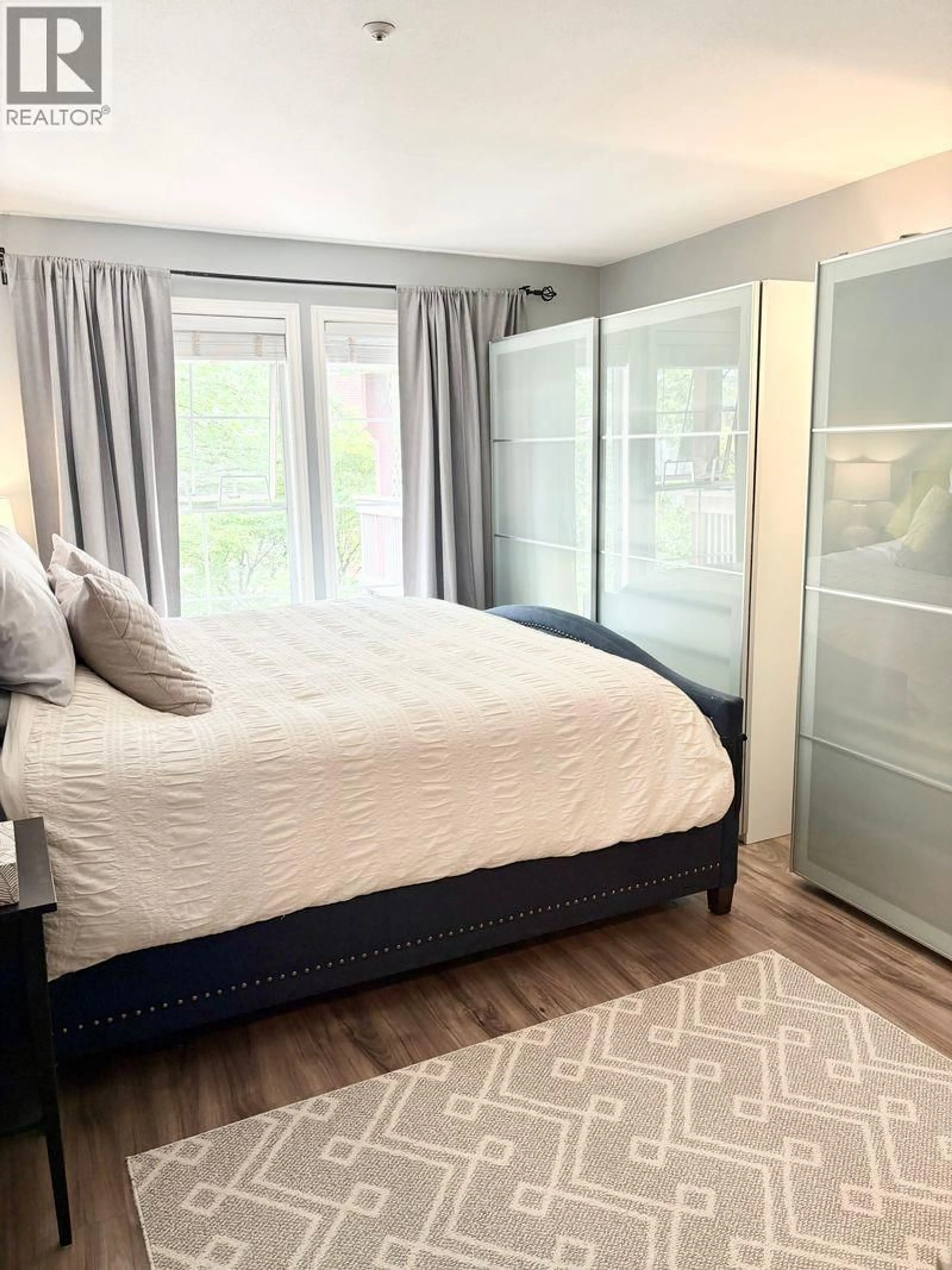 Bedroom with bed, wood/laminate floor for 402 - 888 GAUTHIER AVENUE, Coquitlam British Columbia V3K6Y1