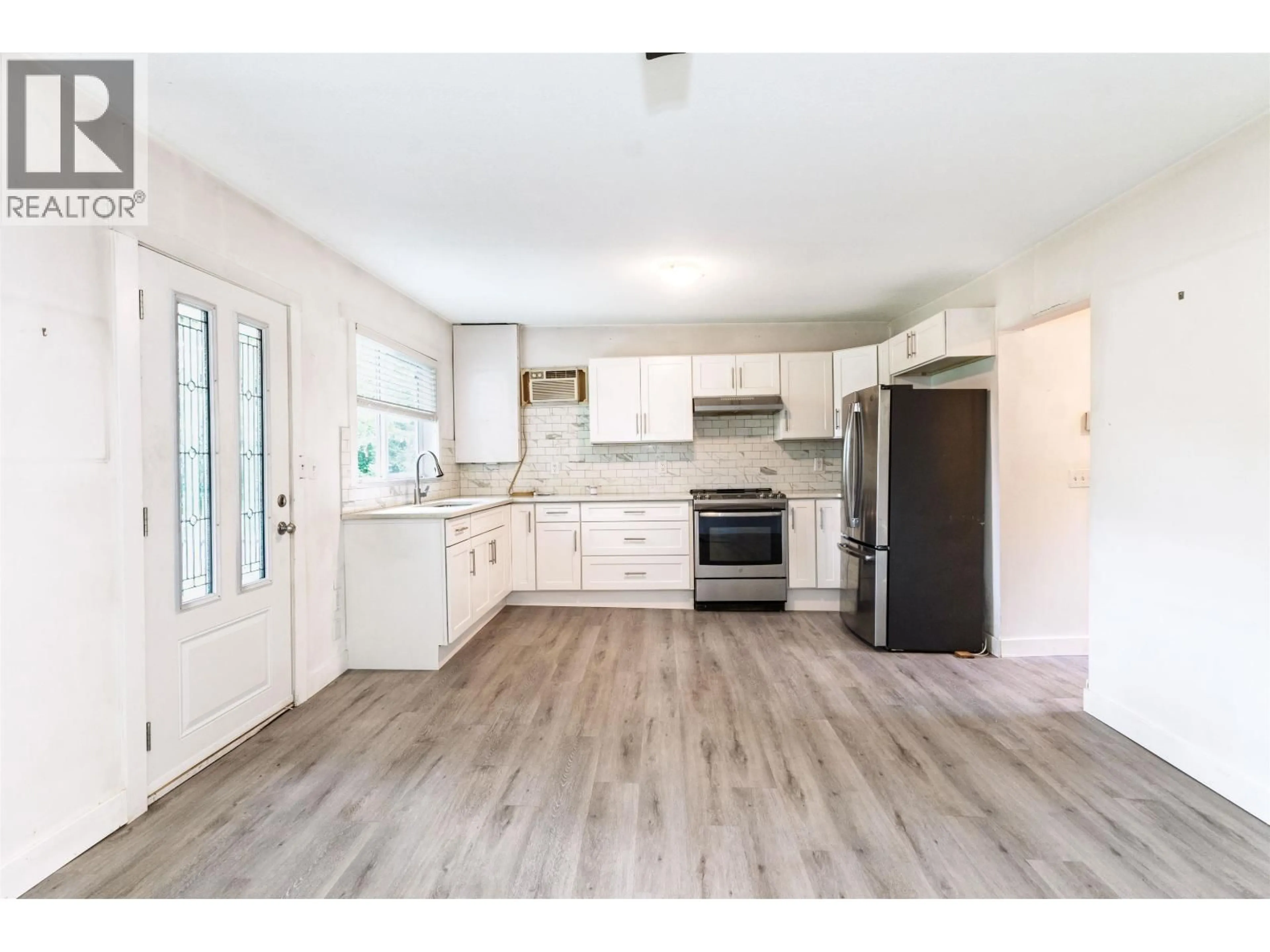 Open concept kitchen, wood/laminate floor for 20420 LORNE AVENUE, Maple Ridge British Columbia V2X1G7