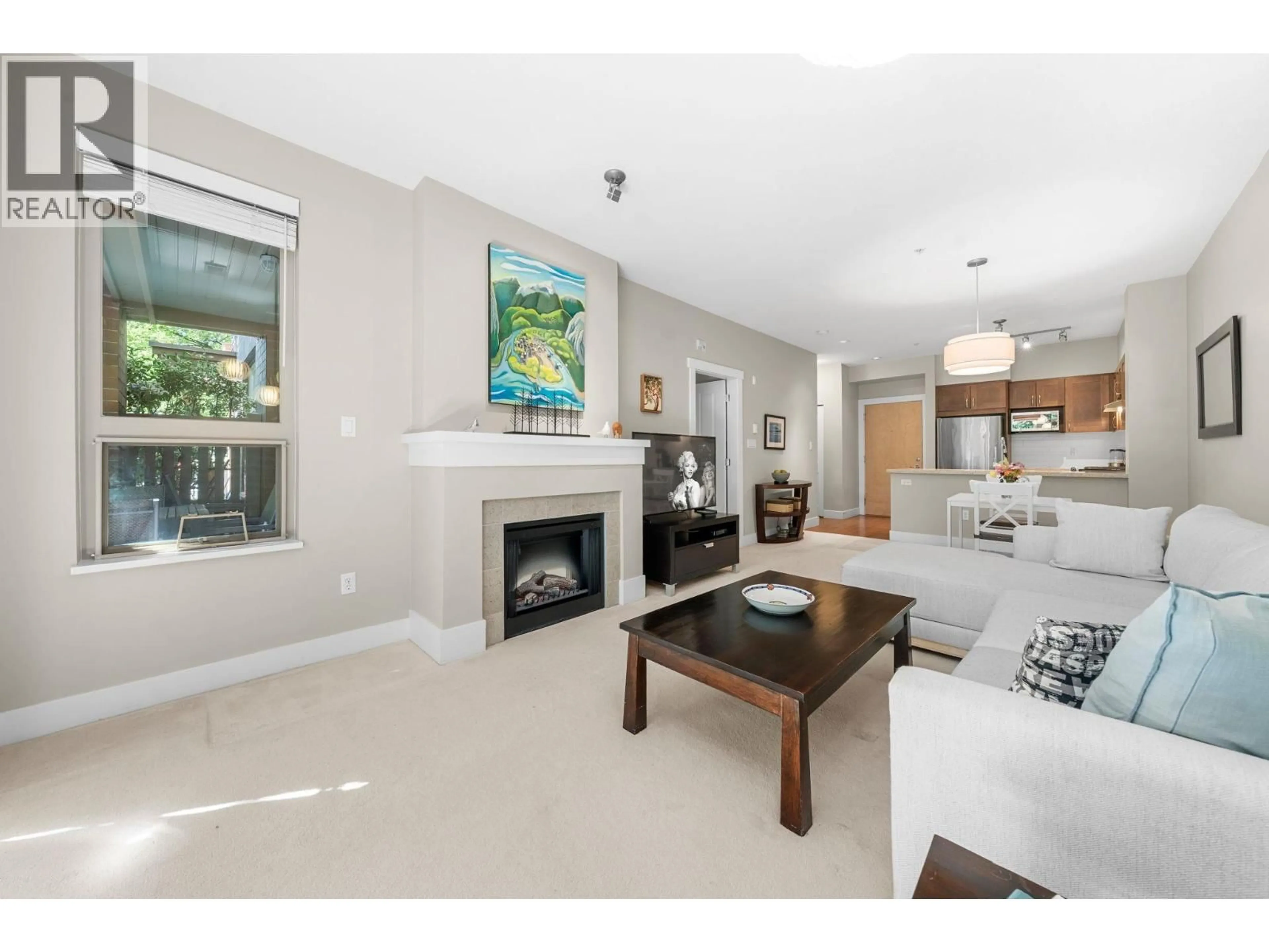 Living room with furniture, ceramic/tile floor for 101 - 2601 WHITELEY COURT, North Vancouver British Columbia V7J2R7