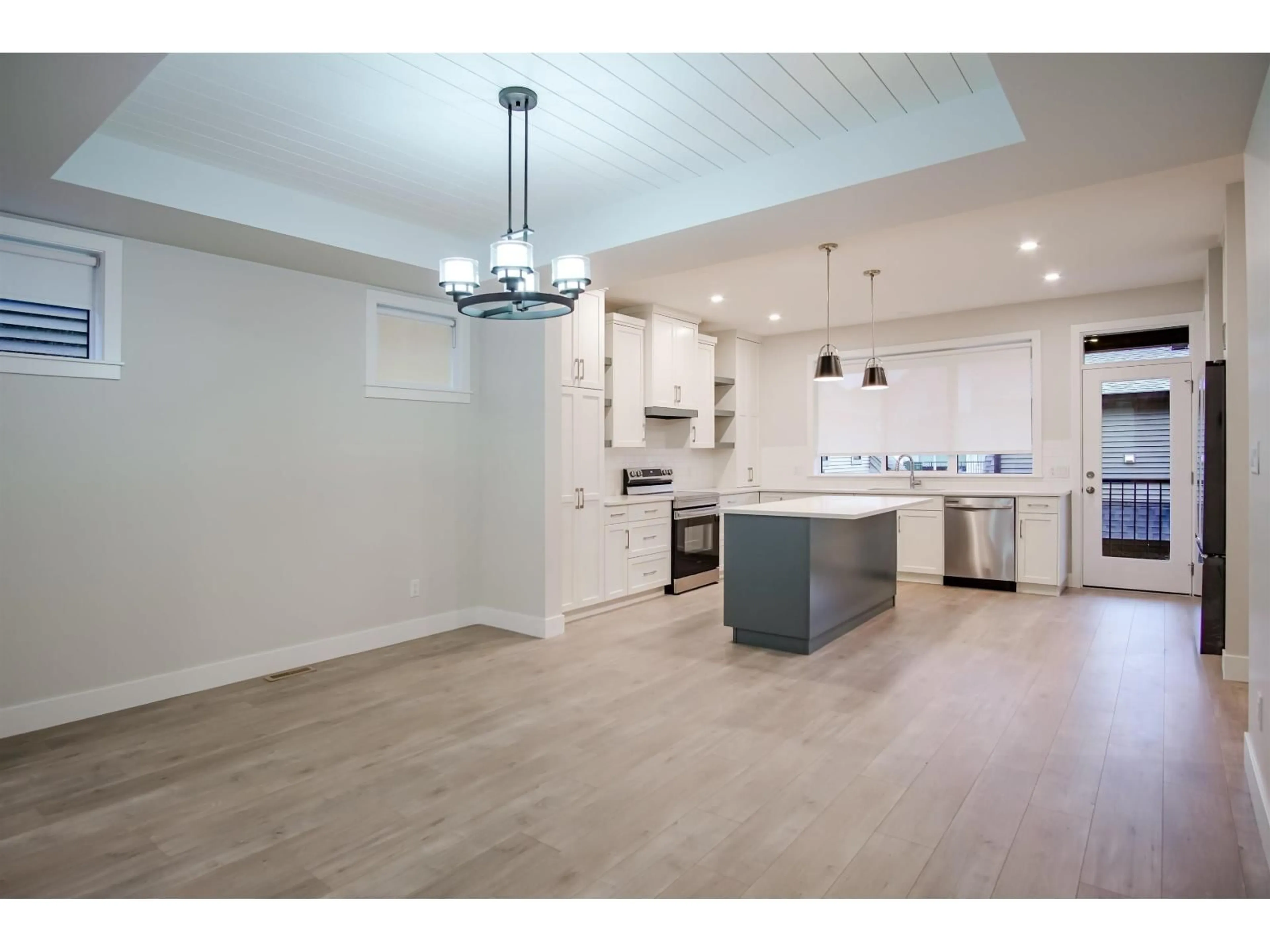 Open concept kitchen, wood/laminate floor for 7858 CEDARBROOK ROAD, Chilliwack British Columbia V2R6G7