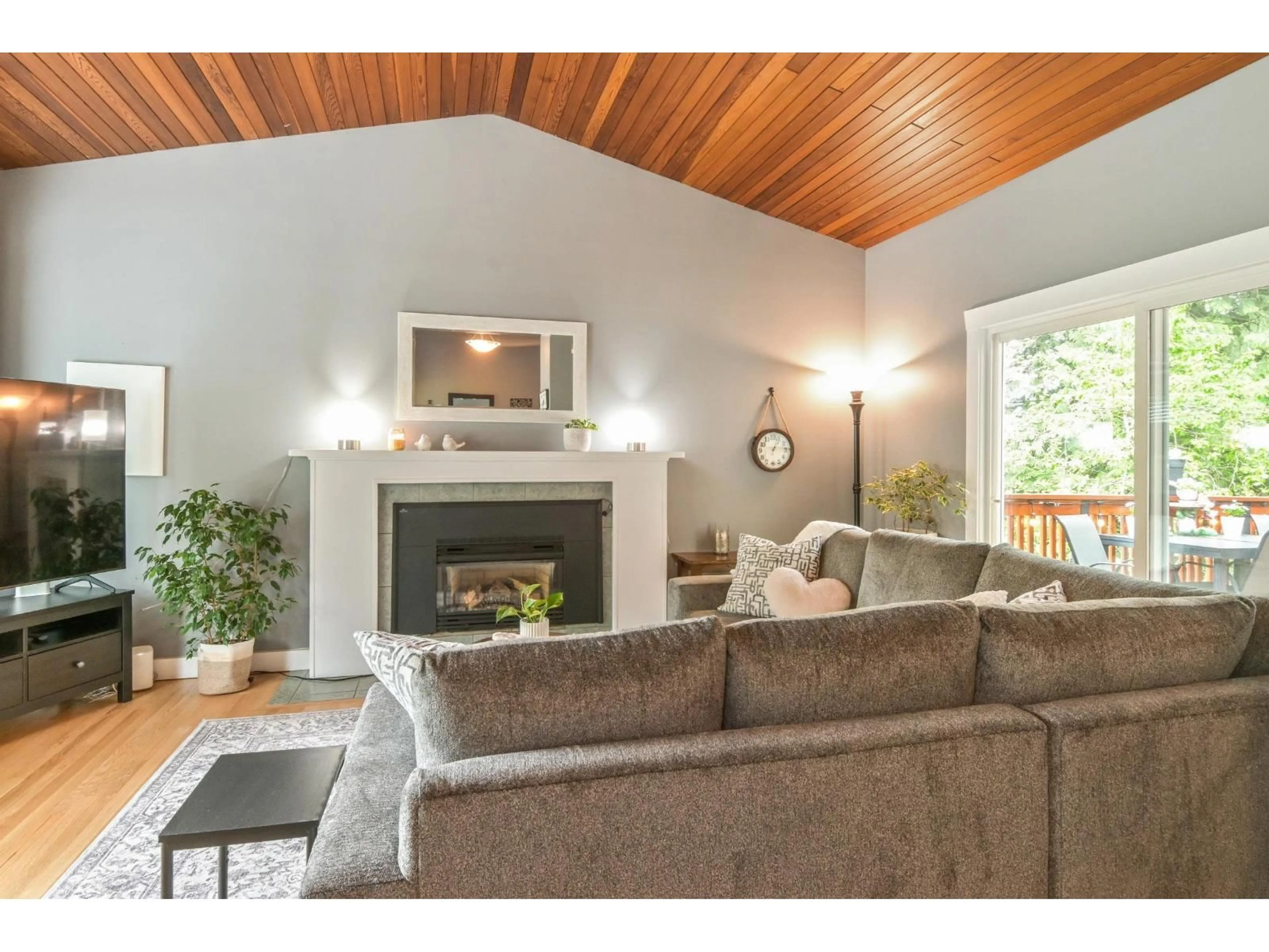 Living room with furniture, wood/laminate floor for 23913 58A AVENUE, Langley British Columbia V2Z1A5