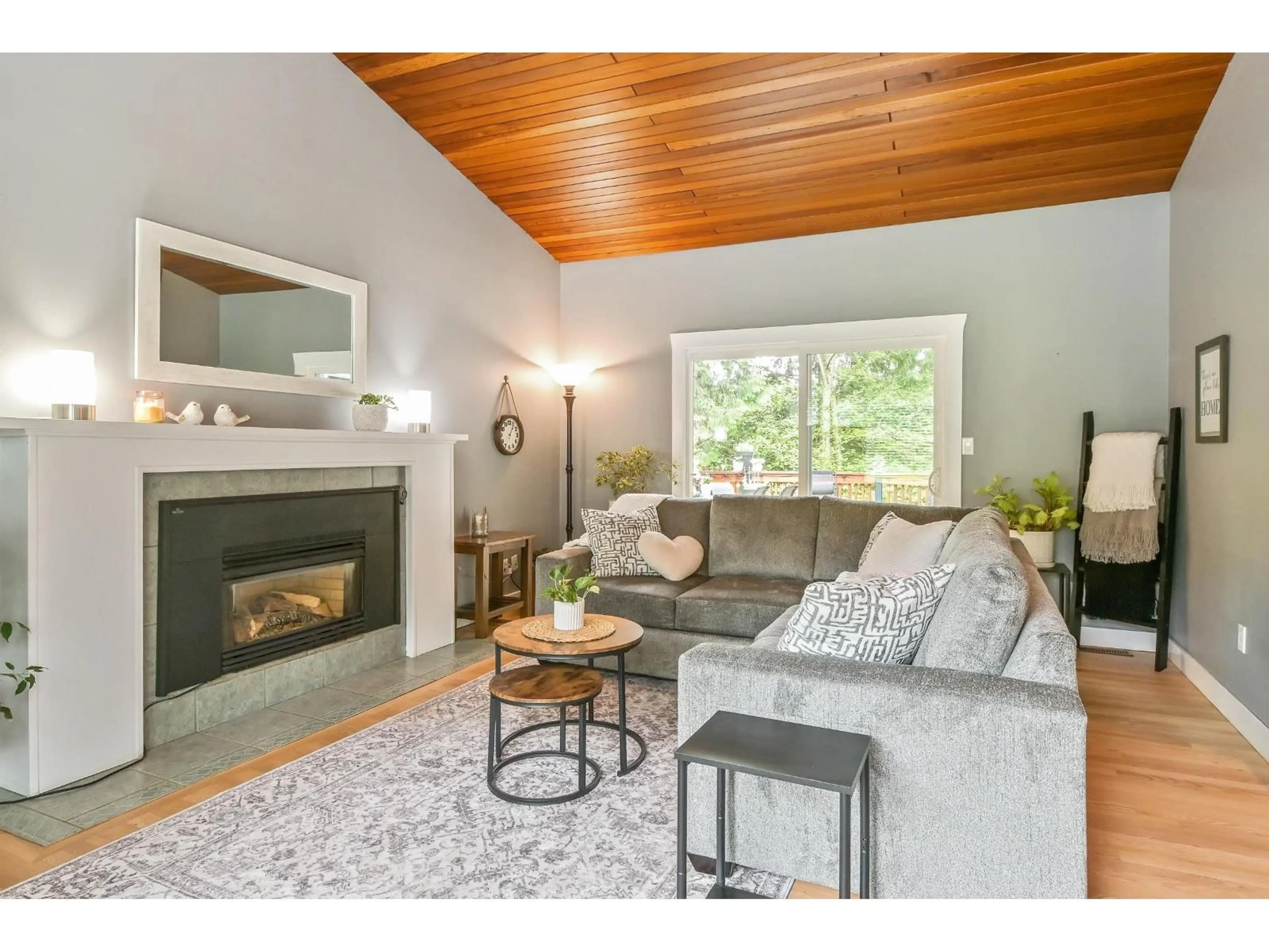 Living room with furniture, wood/laminate floor for 23913 58A AVENUE, Langley British Columbia V2Z1A5