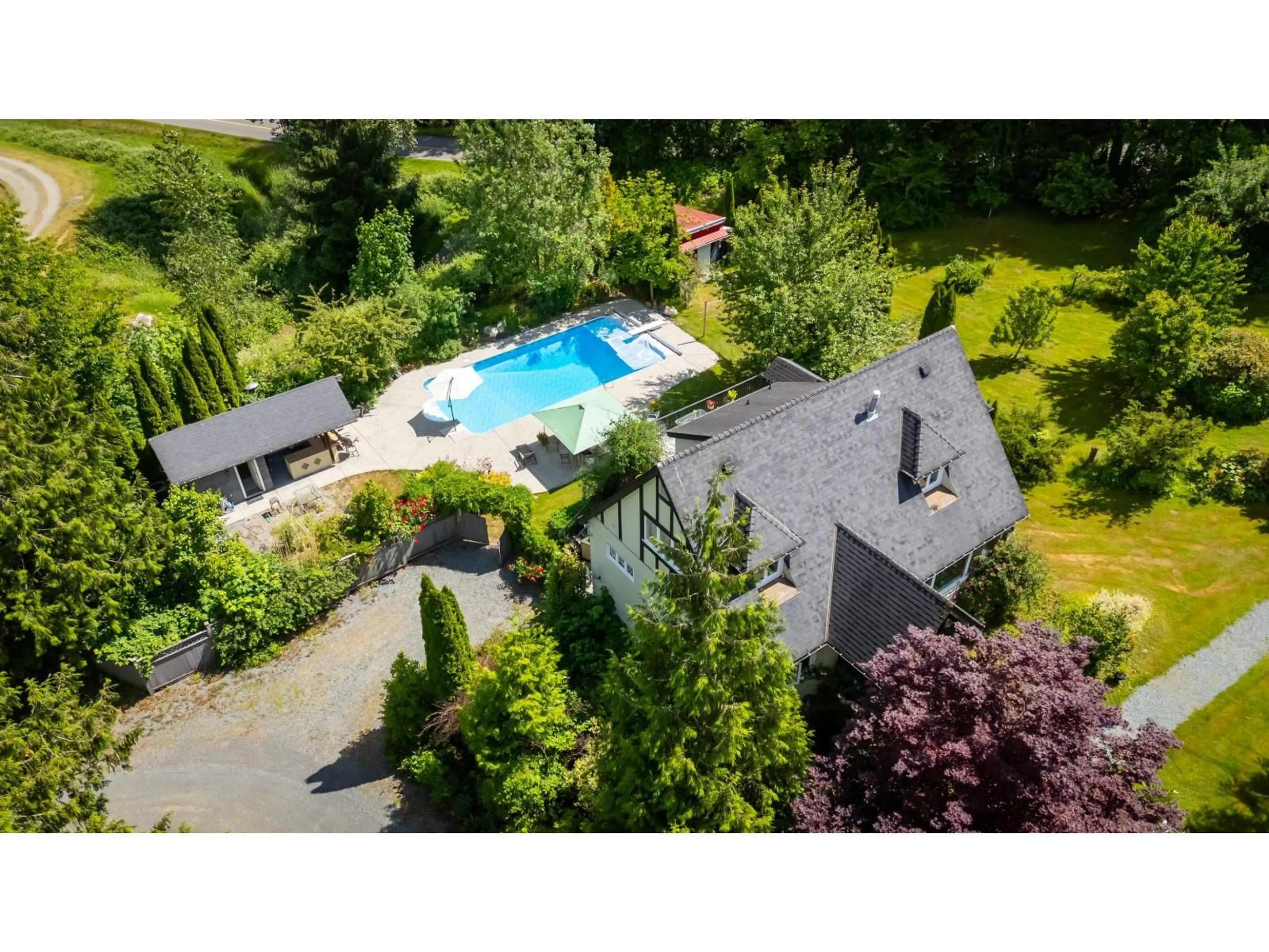 A pic from outside/outdoor area/front of a property/back of a property/a pic from drone, street for 8561 BRADNER ROAD, Abbotsford British Columbia V4X2H5