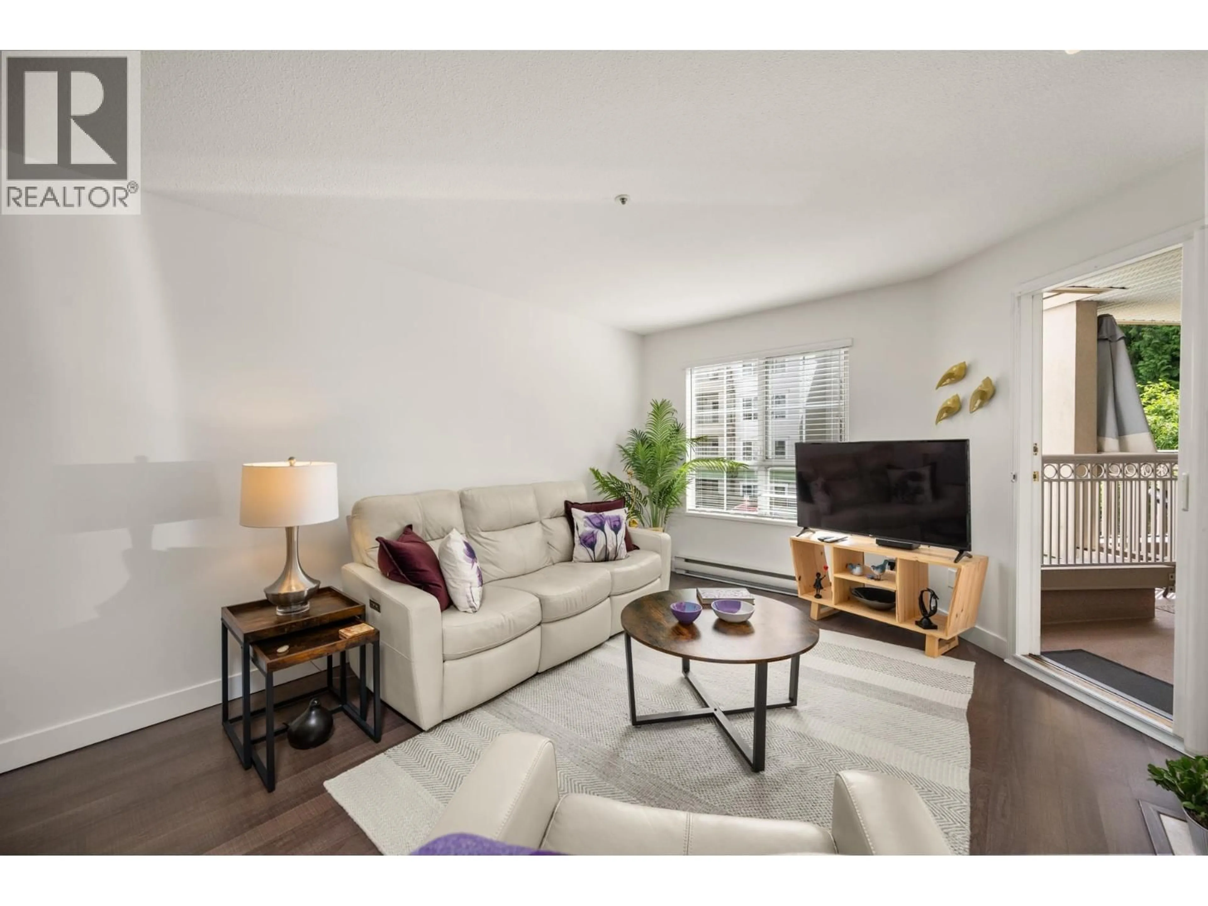 Living room with furniture, wood/laminate floor for 209 - 2975 PRINCESS CRESCENT, Coquitlam British Columbia V3B7N3