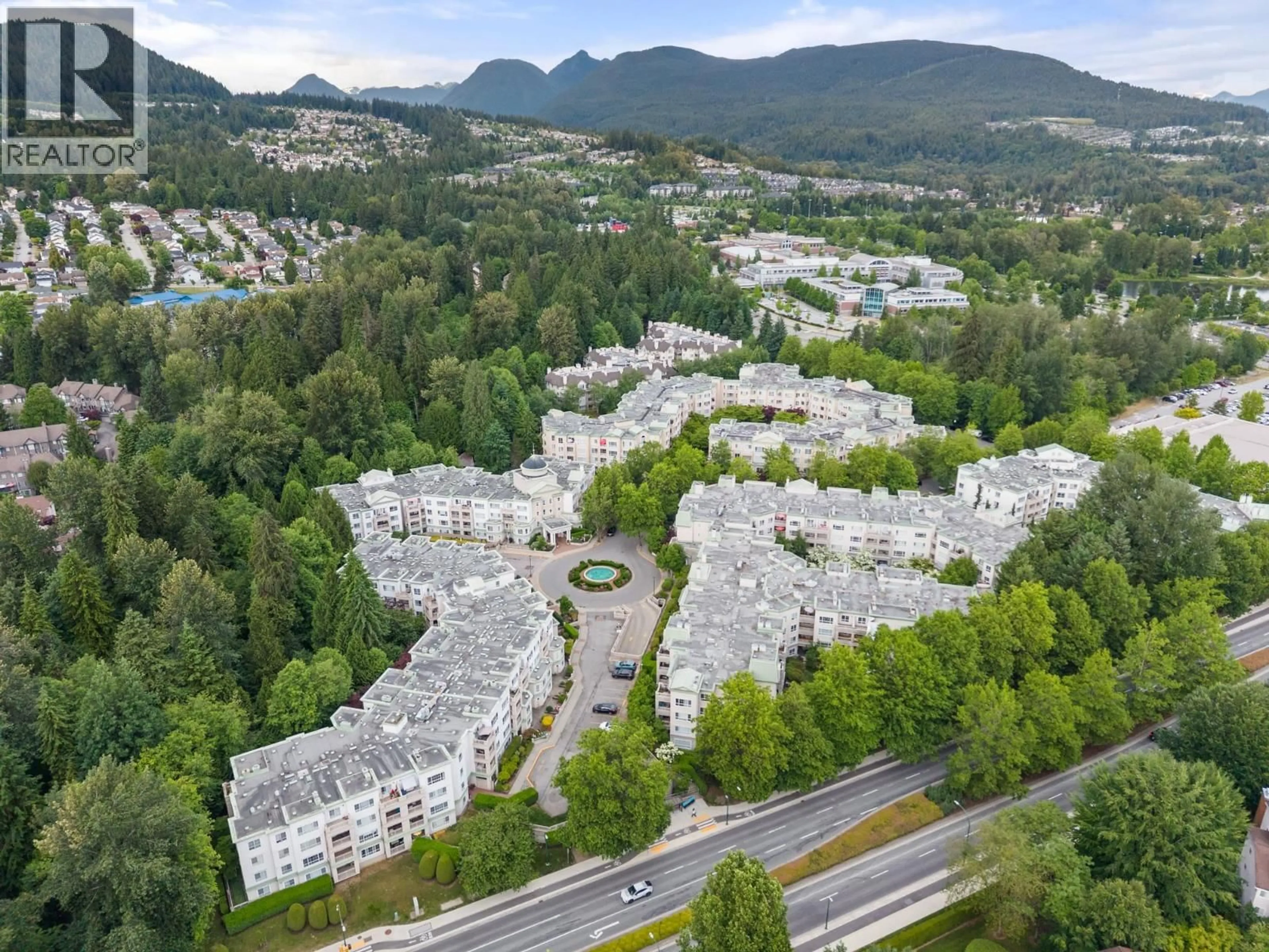 A pic from outside/outdoor area/front of a property/back of a property/a pic from drone, mountain view for 209 - 2975 PRINCESS CRESCENT, Coquitlam British Columbia V3B7N3