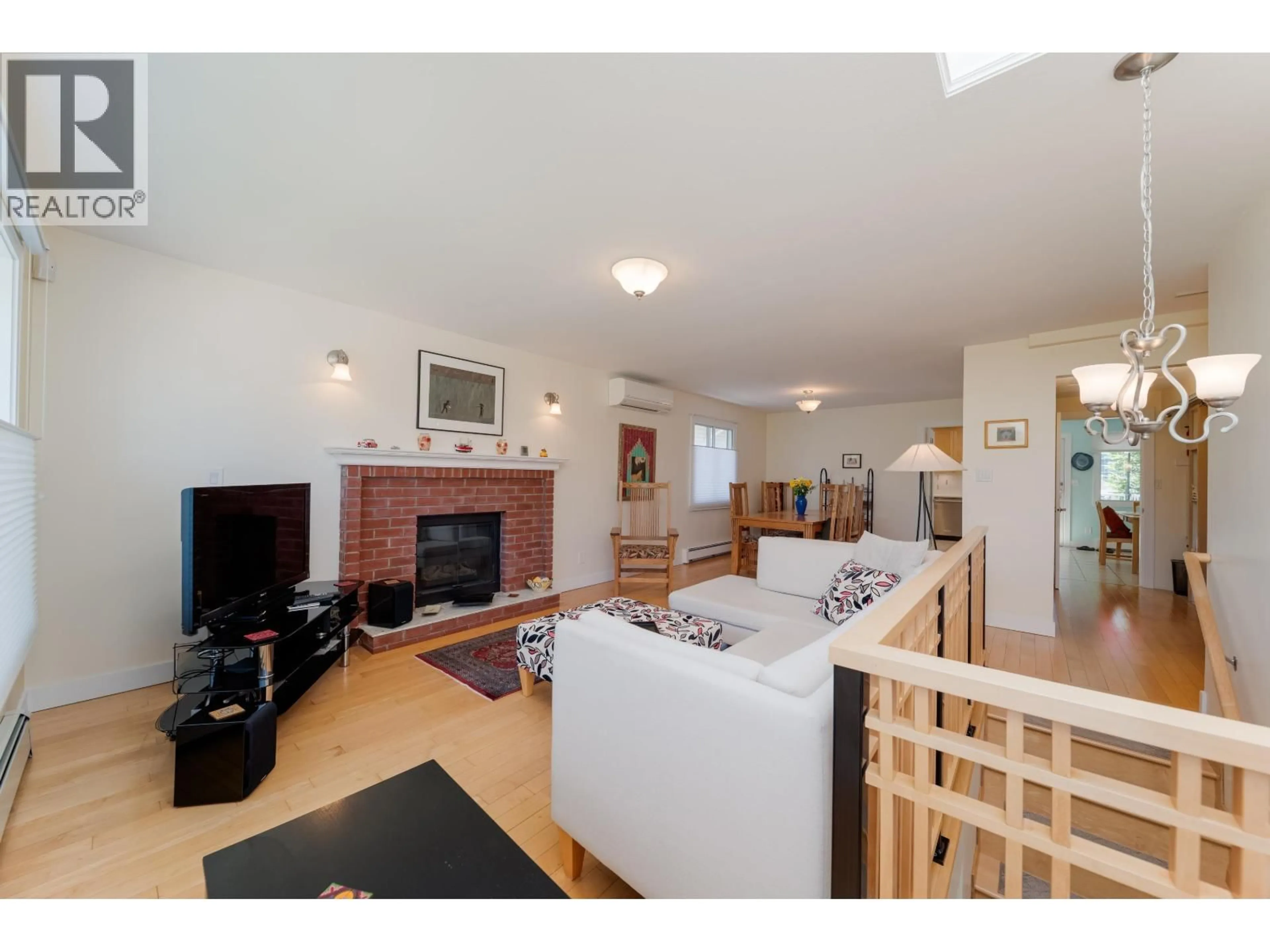 Living room with furniture, wood/laminate floor for 4432 GRAVELEY STREET, Burnaby British Columbia V5C3T8