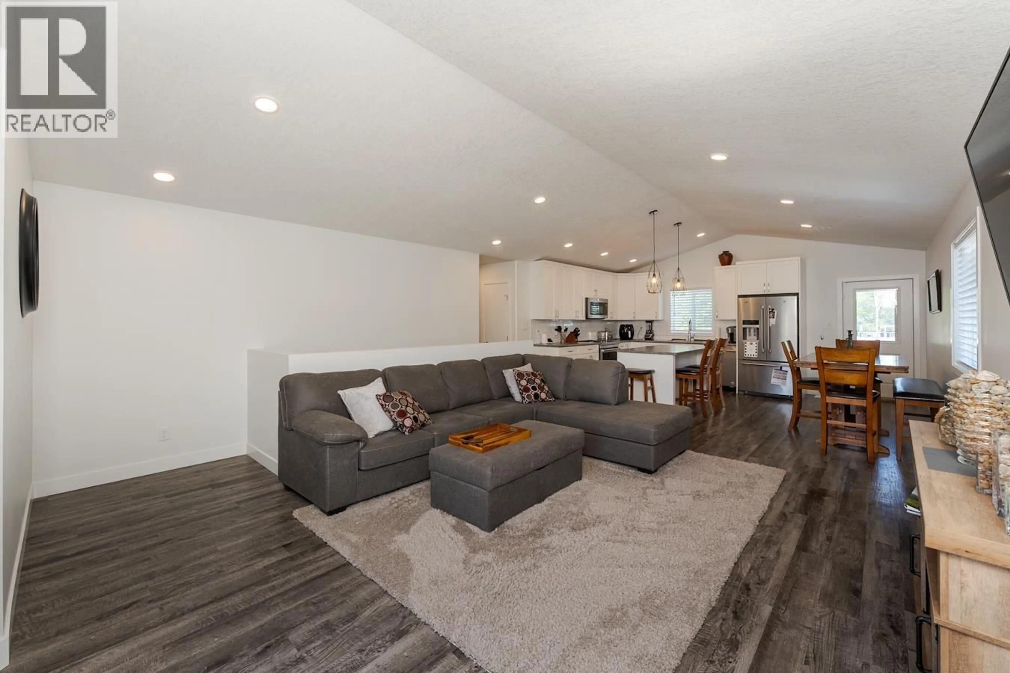 Living room with furniture, wood/laminate floor for 7034 HILLU ROAD, Prince George British Columbia V2K0B4