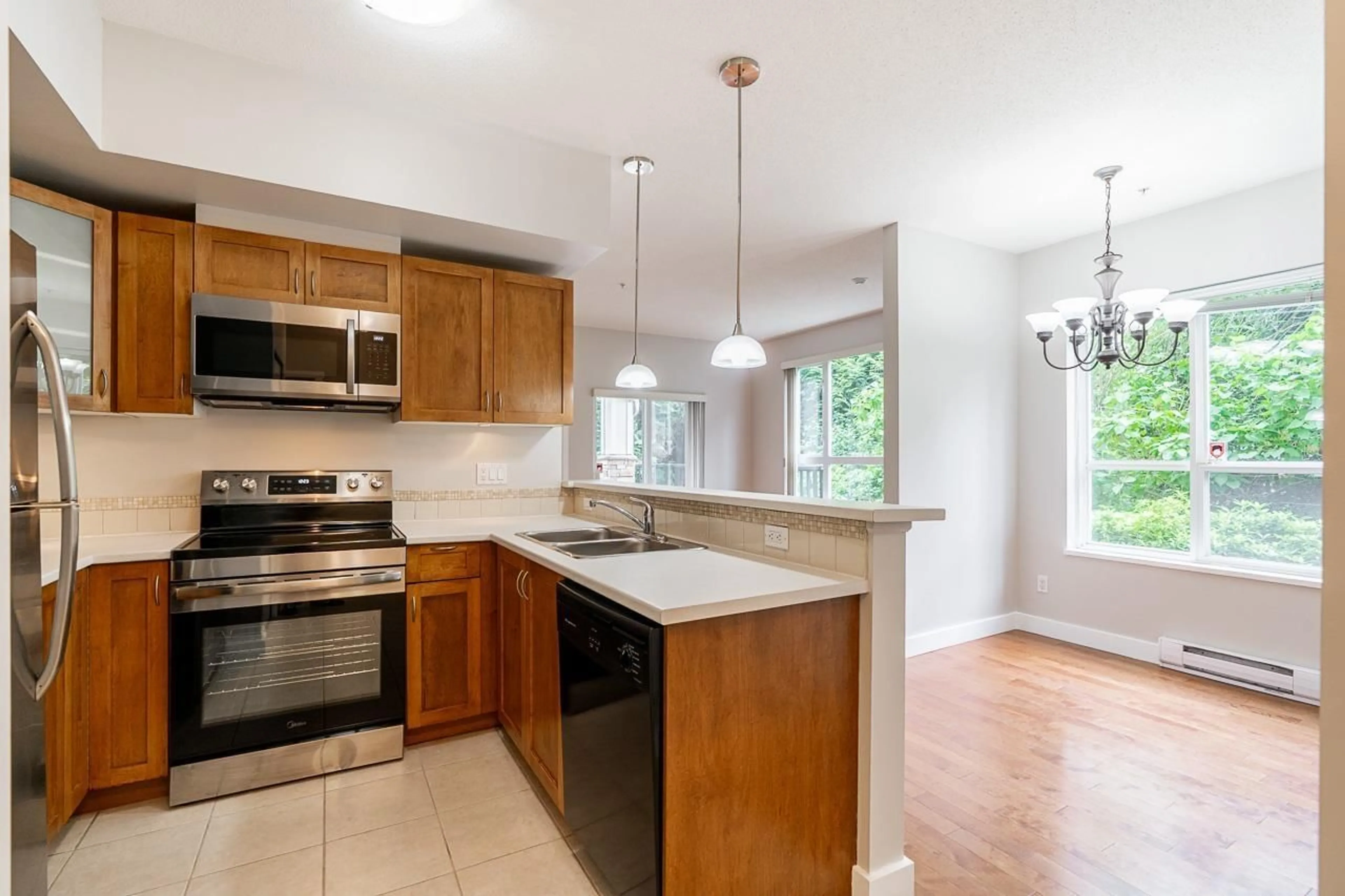 Open concept kitchen, unknown for 106 - 15265 17A AVENUE, Surrey British Columbia V4A1V4