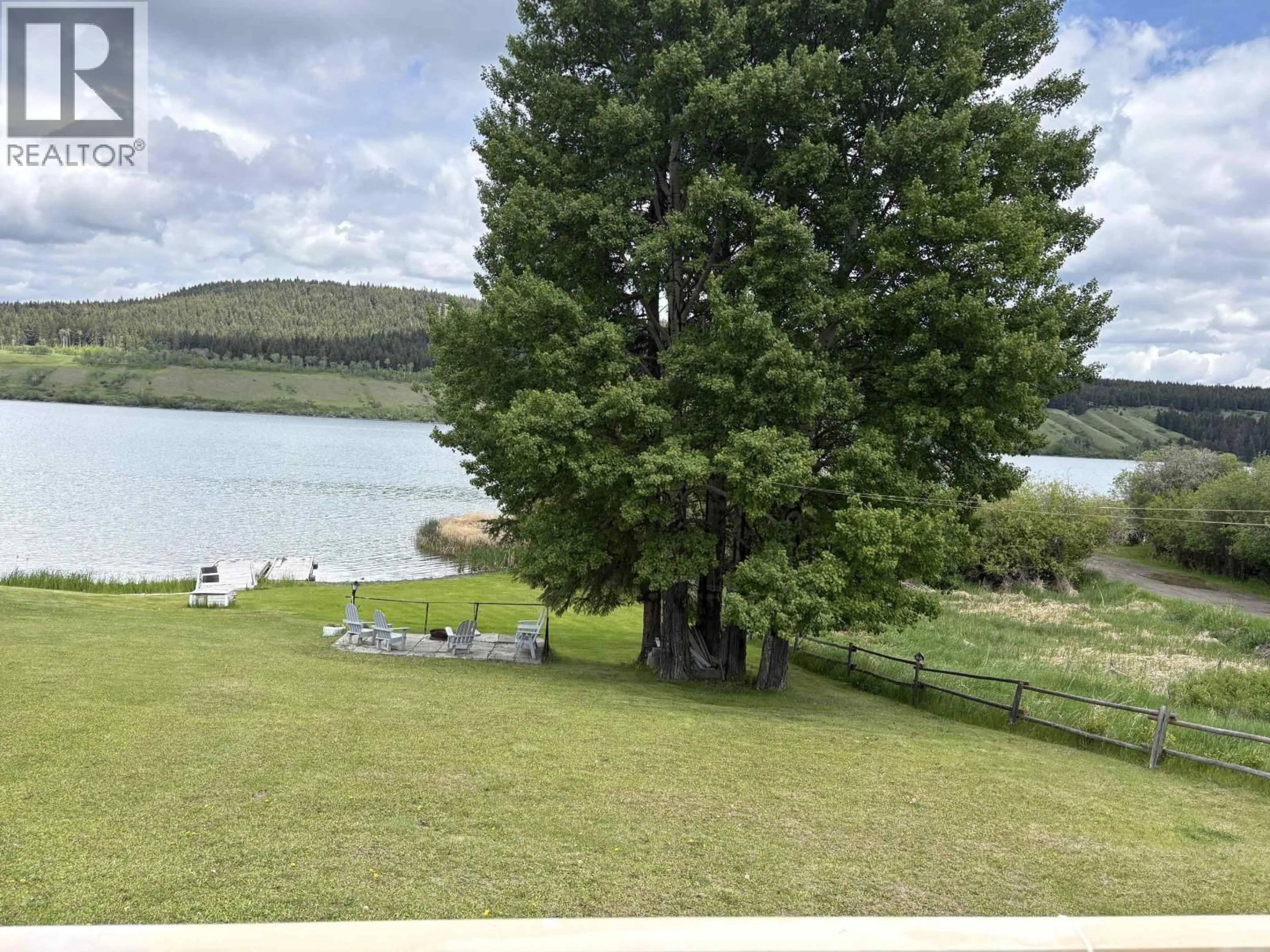 A pic from outside/outdoor area/front of a property/back of a property/a pic from drone, water/lake/river/ocean view for 6179 HUNT ROAD, 100 Mile House British Columbia V0K2E3