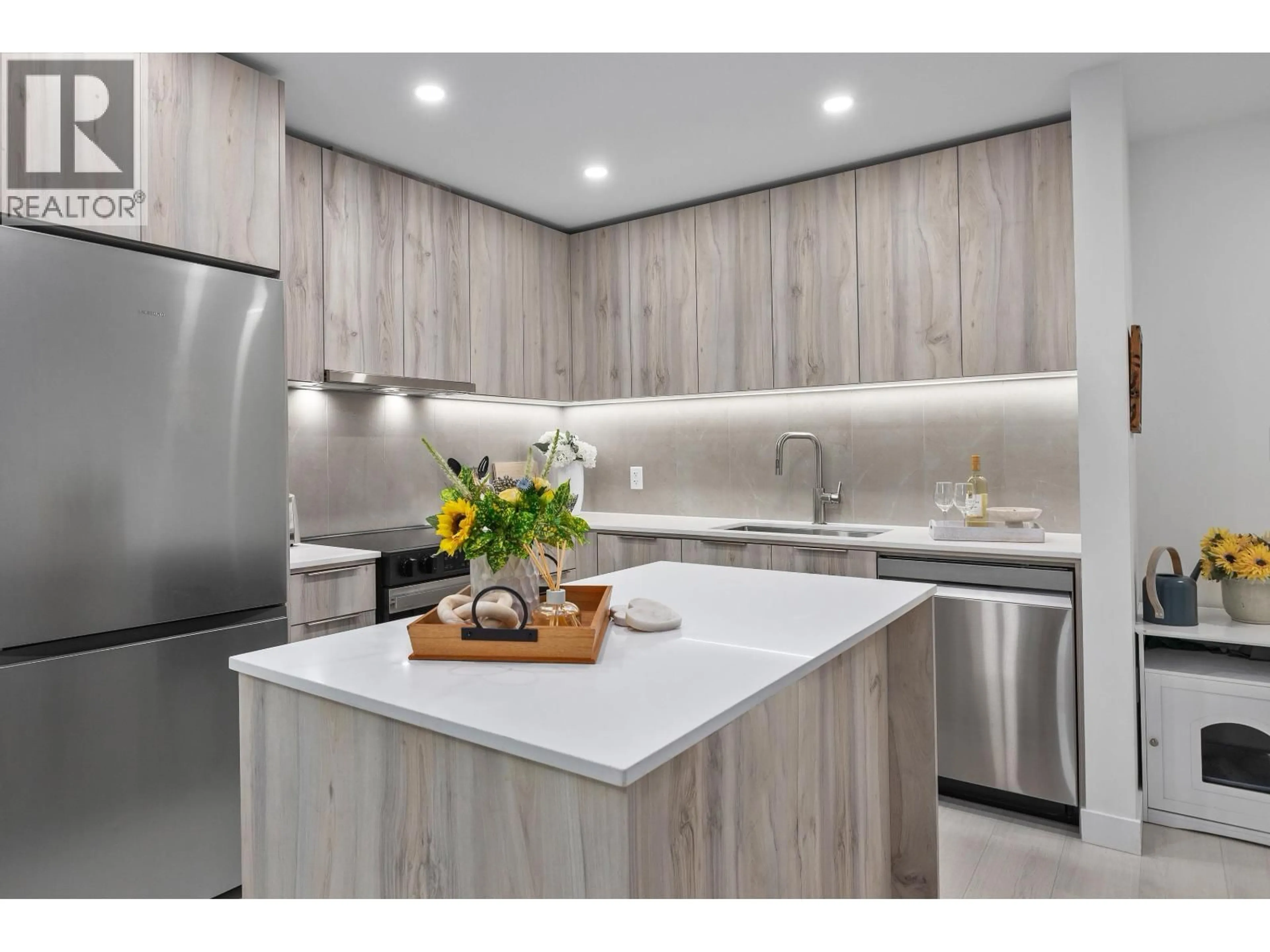 Contemporary kitchen, wood/laminate floor for 203 - 3596 MALSUM DRIVE, North Vancouver British Columbia V7G0B5