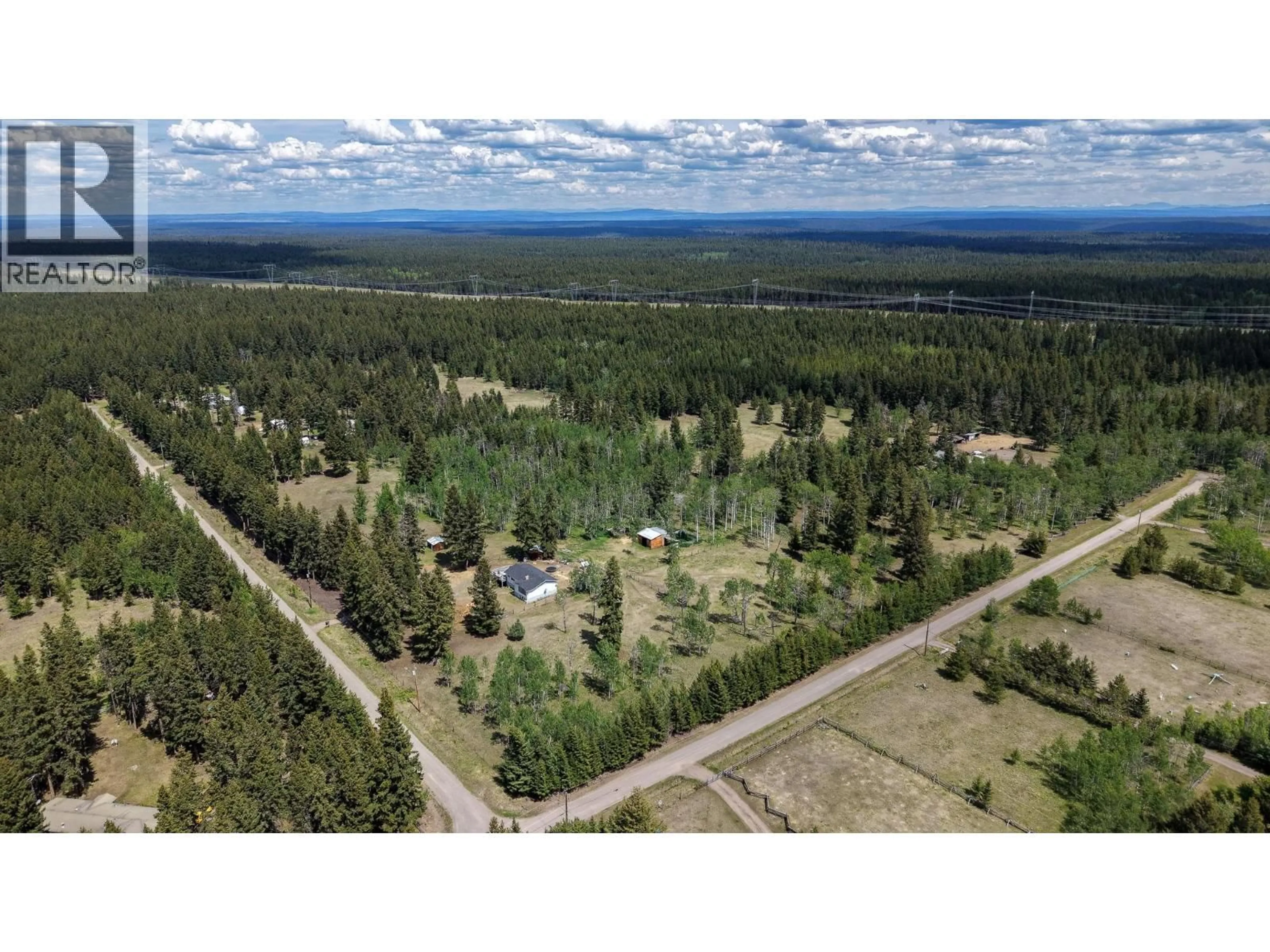 A pic from outside/outdoor area/front of a property/back of a property/a pic from drone, forest/trees view for 3322 CRANE ROAD, Williams Lake British Columbia V2G4X4