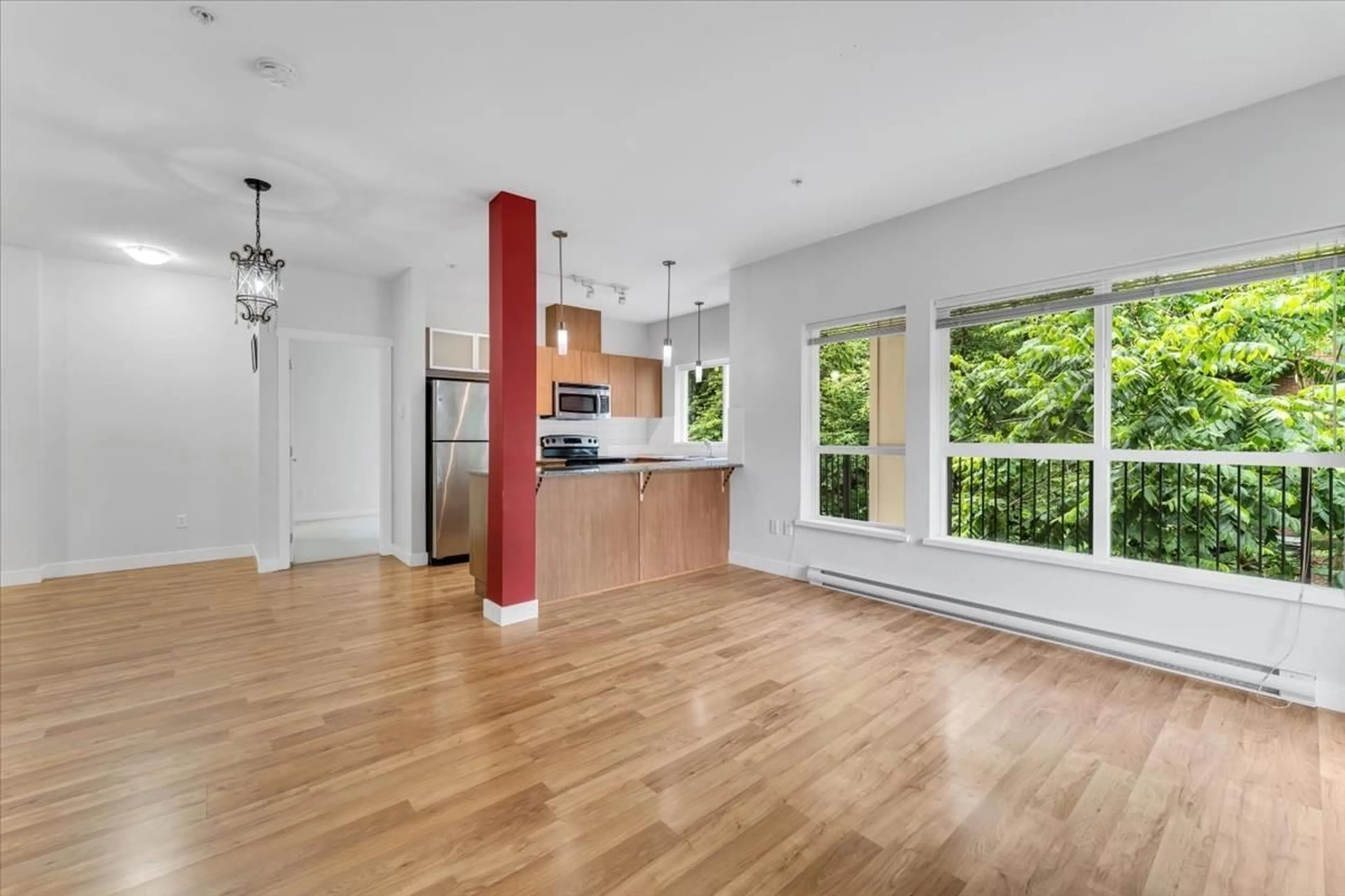 Open concept kitchen, wood/laminate floor for 215 - 9655 KING GEORGE BOULEVARD, Surrey British Columbia V3T0C7