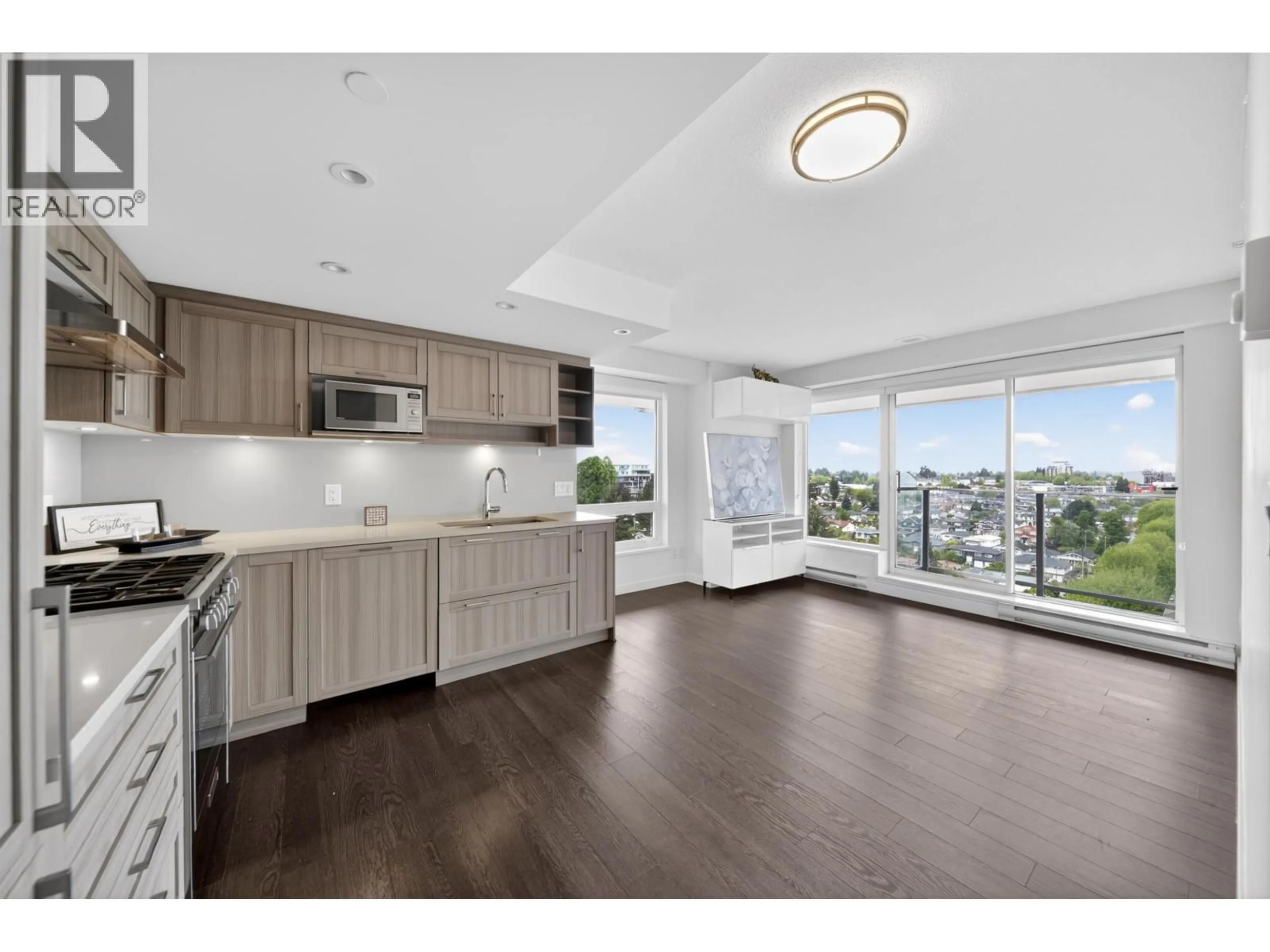 Open concept kitchen, wood/laminate floor for 1502 - 5470 ORMIDALE STREET, Vancouver British Columbia V5R0G6