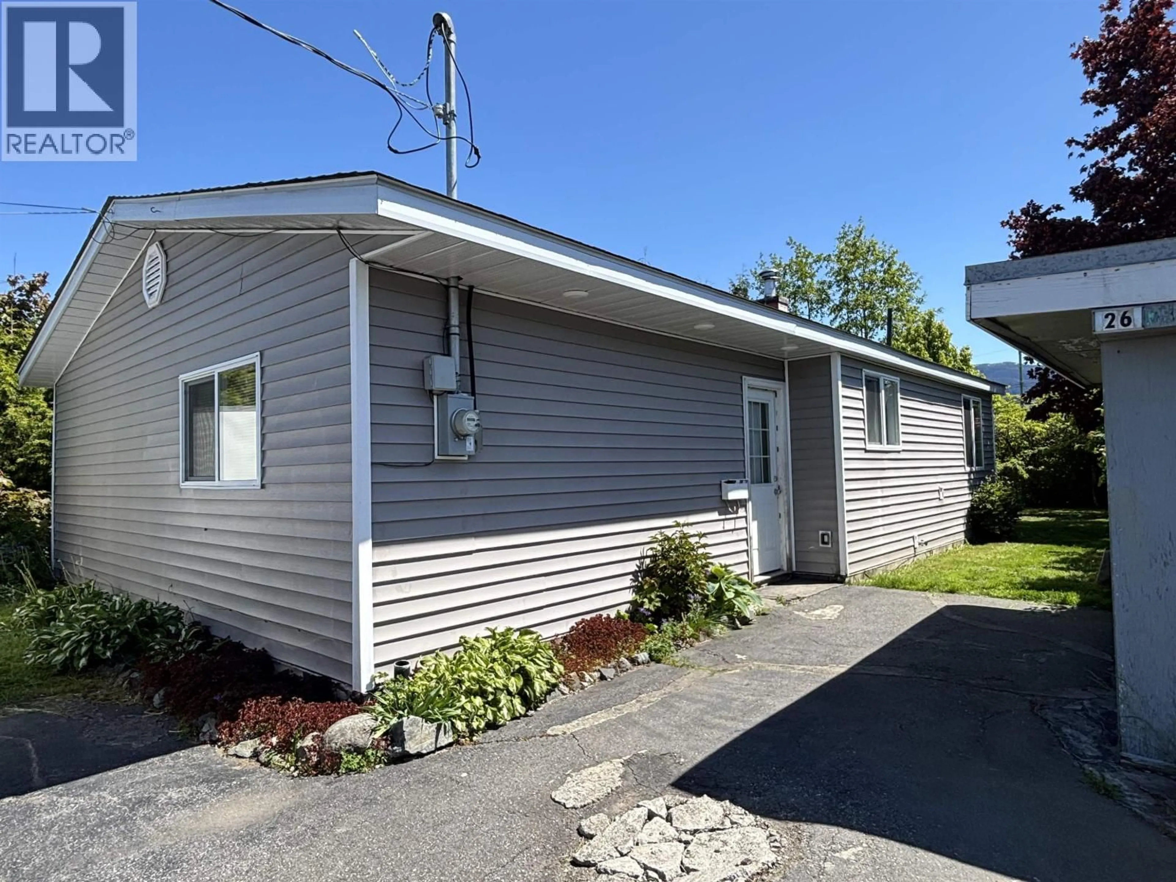 Home with vinyl exterior material, street for 26 STARLING STREET, Kitimat British Columbia V8C1K5