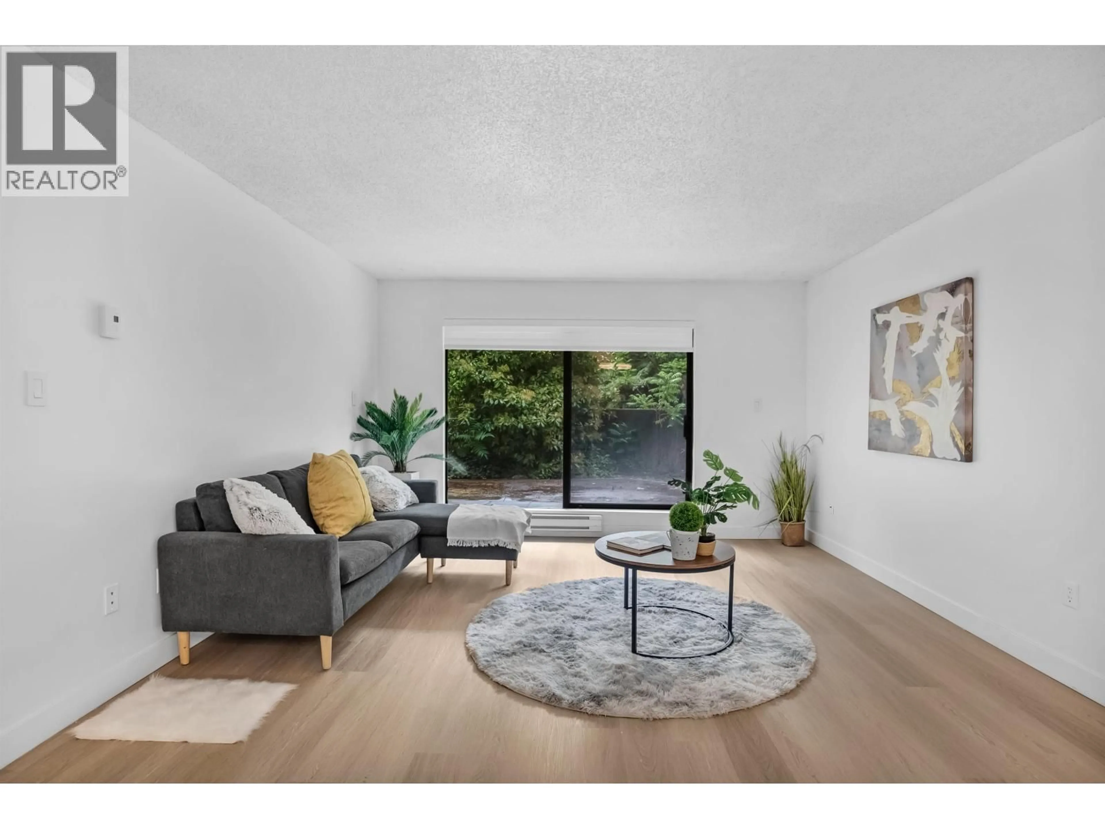 Living room with furniture, unknown for 111 - 6931 COONEY ROAD, Richmond British Columbia V6Y2J9