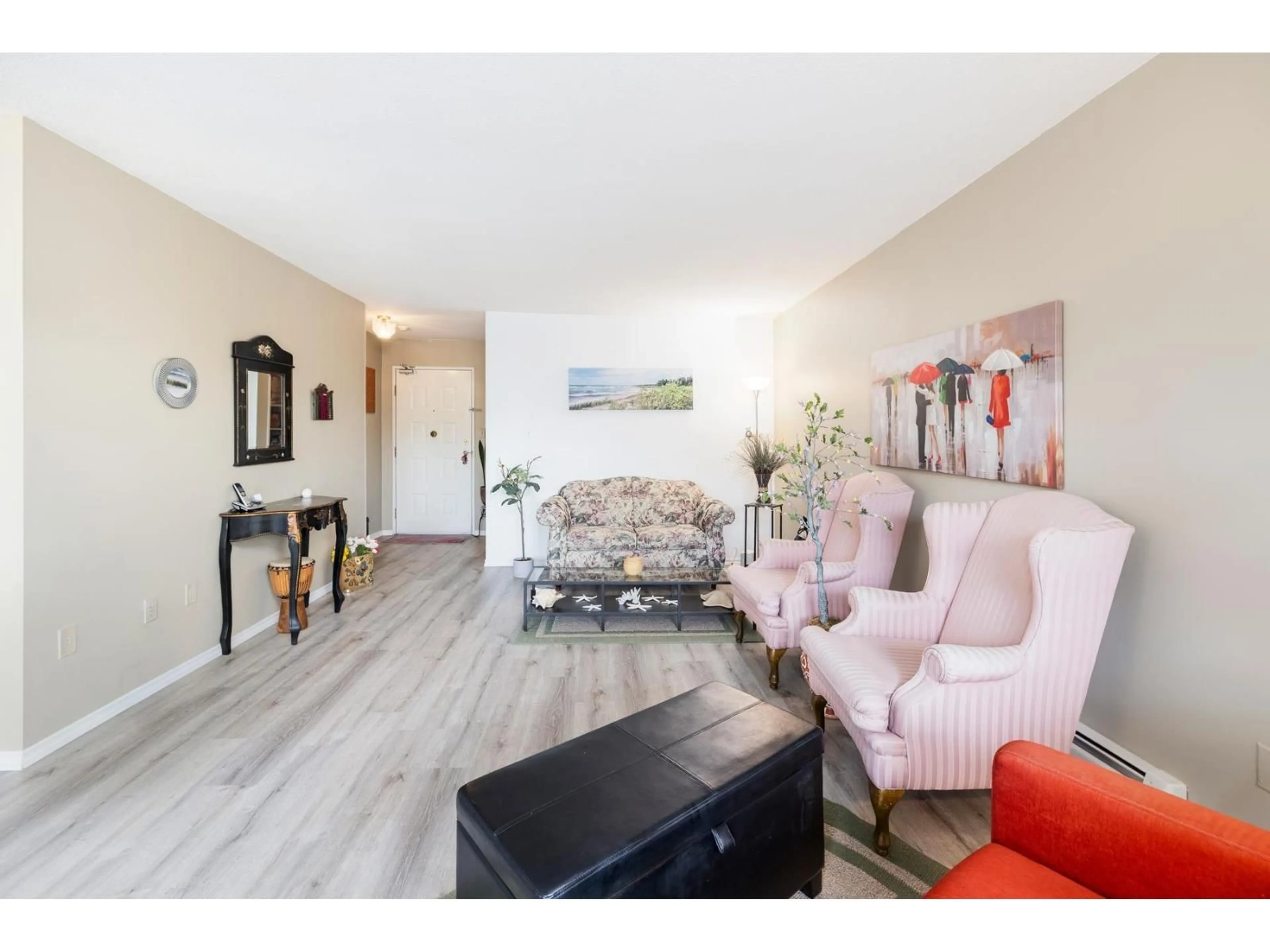 Living room with furniture, wood/laminate floor for 211 - 31955 OLD YALE ROAD, Abbotsford British Columbia V2T4N1