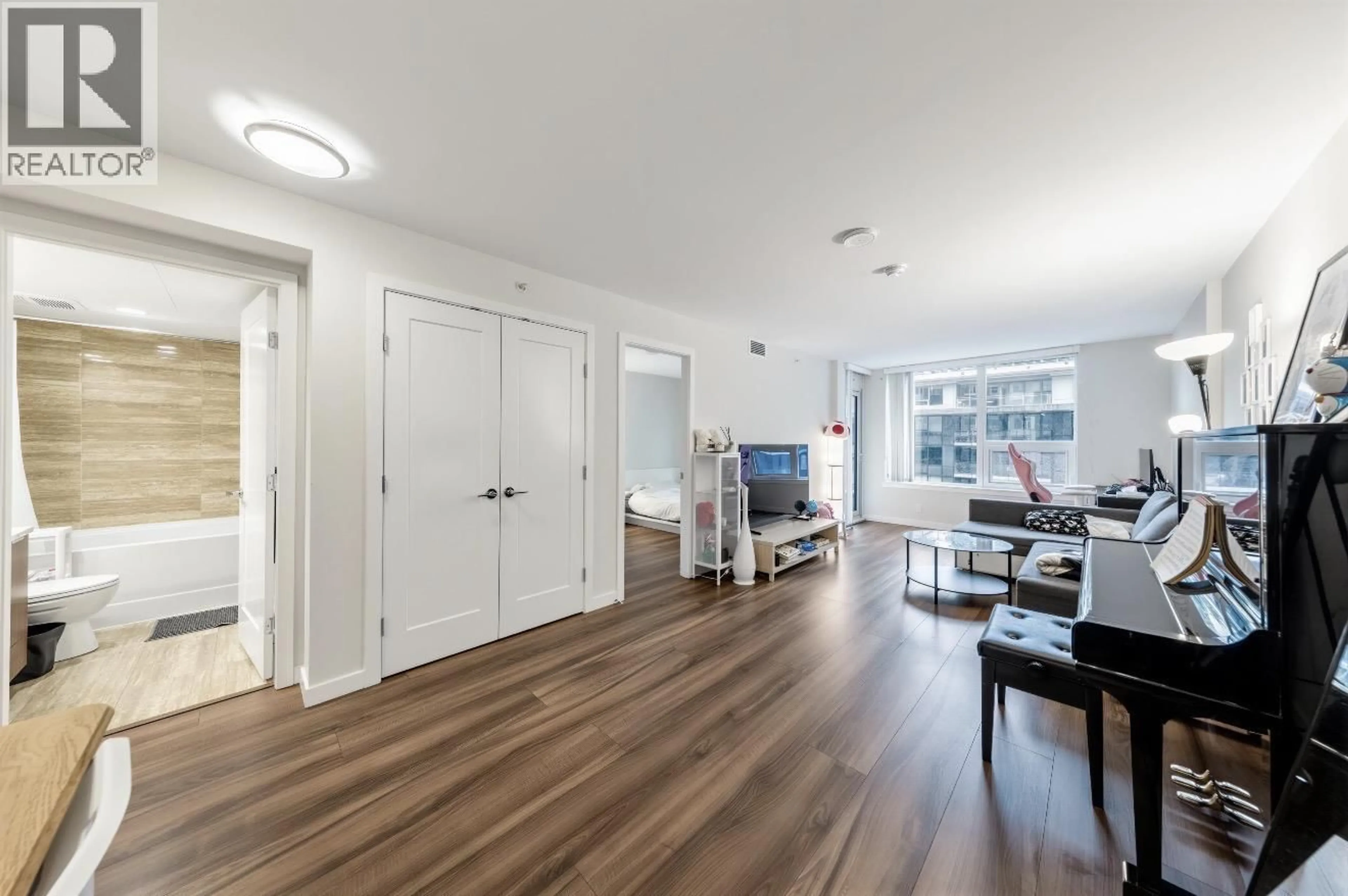 Living room with furniture, wood/laminate floor for 704 - 8699 HAZELBRIDGE WAY, Richmond British Columbia V6X0T4