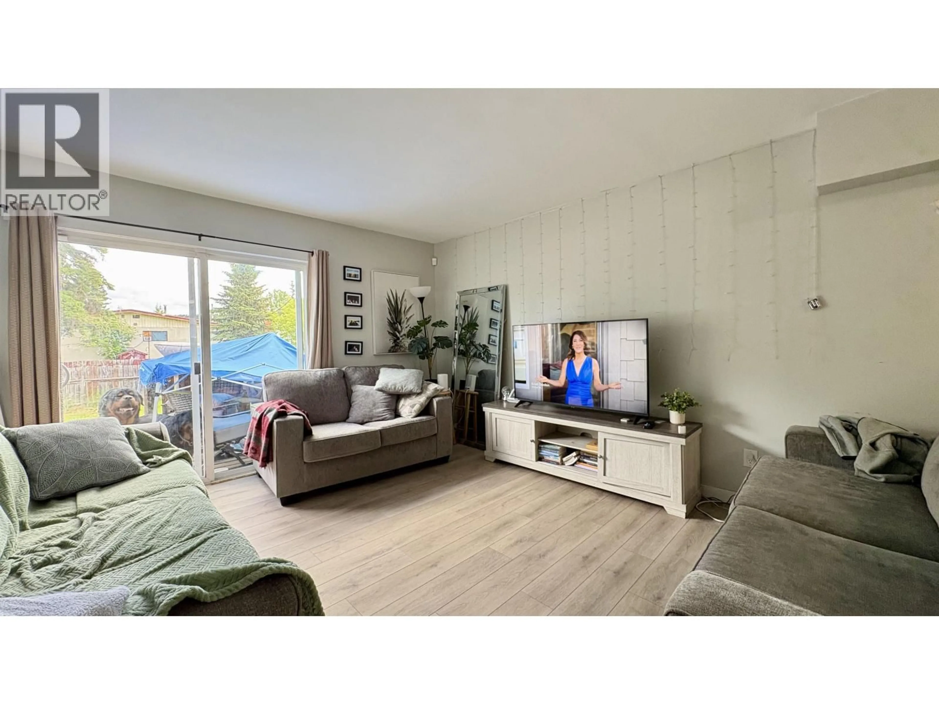Living room with furniture, wood/laminate floor for 2124 QUINCE STREET, Prince George British Columbia V2L2H1